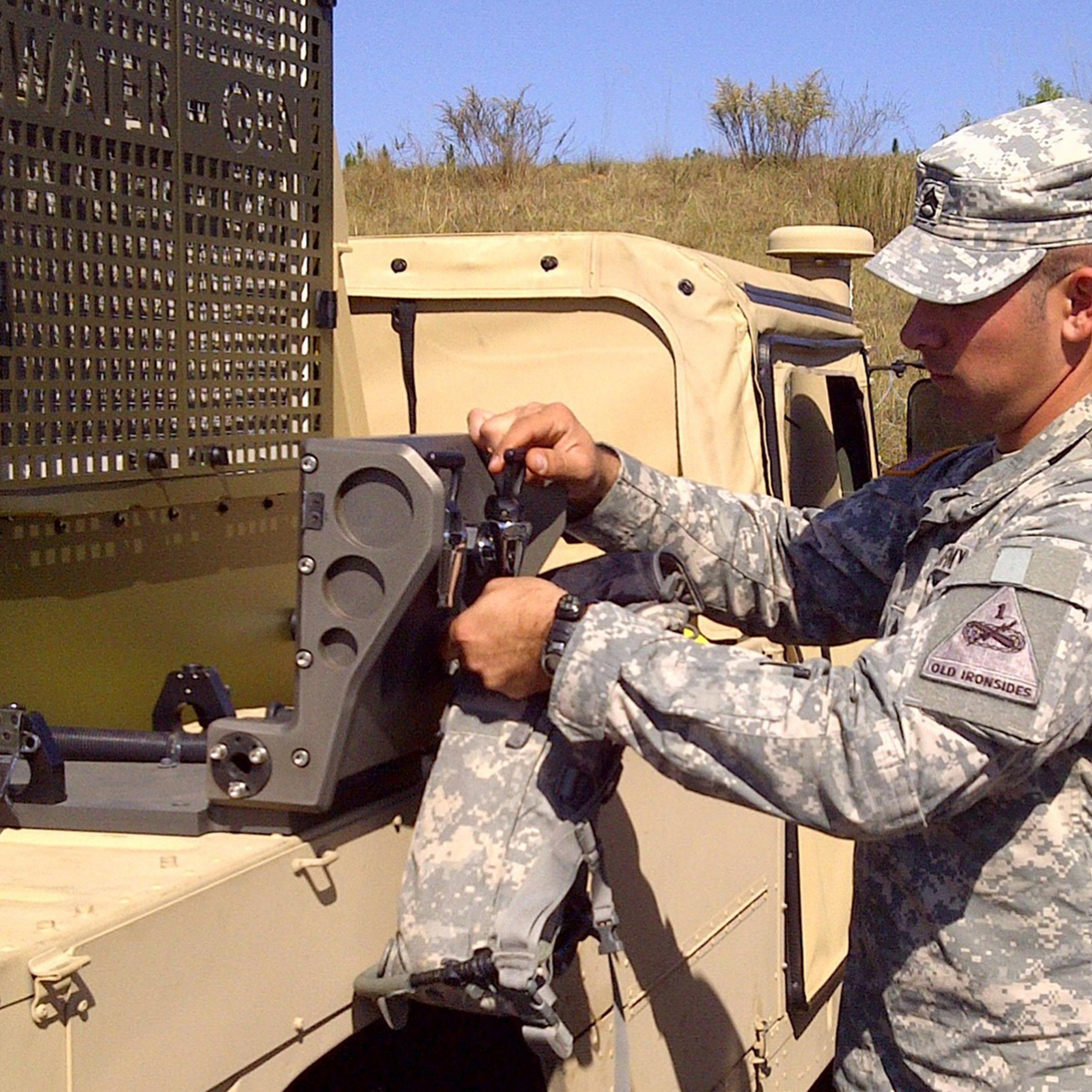 A U.S. Army member pours water generated by Water-Gen's Atmospheric Water-Generation Unit during an exercise.