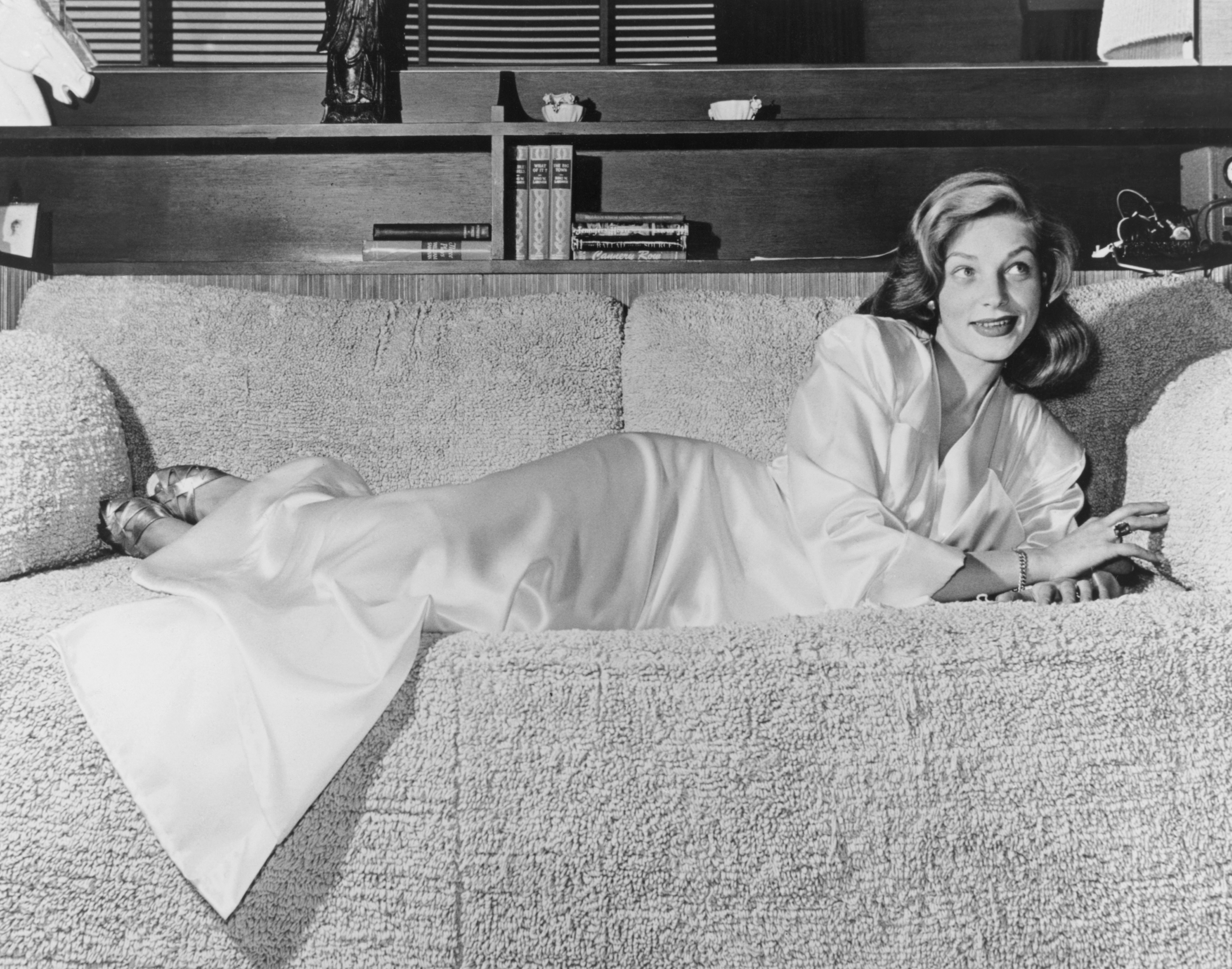 Actress Lauren Bacall pictured relaxing on a plush terry towelling sofa, USA, circa 1945. (Photo by Archive Photos/Getty Images)