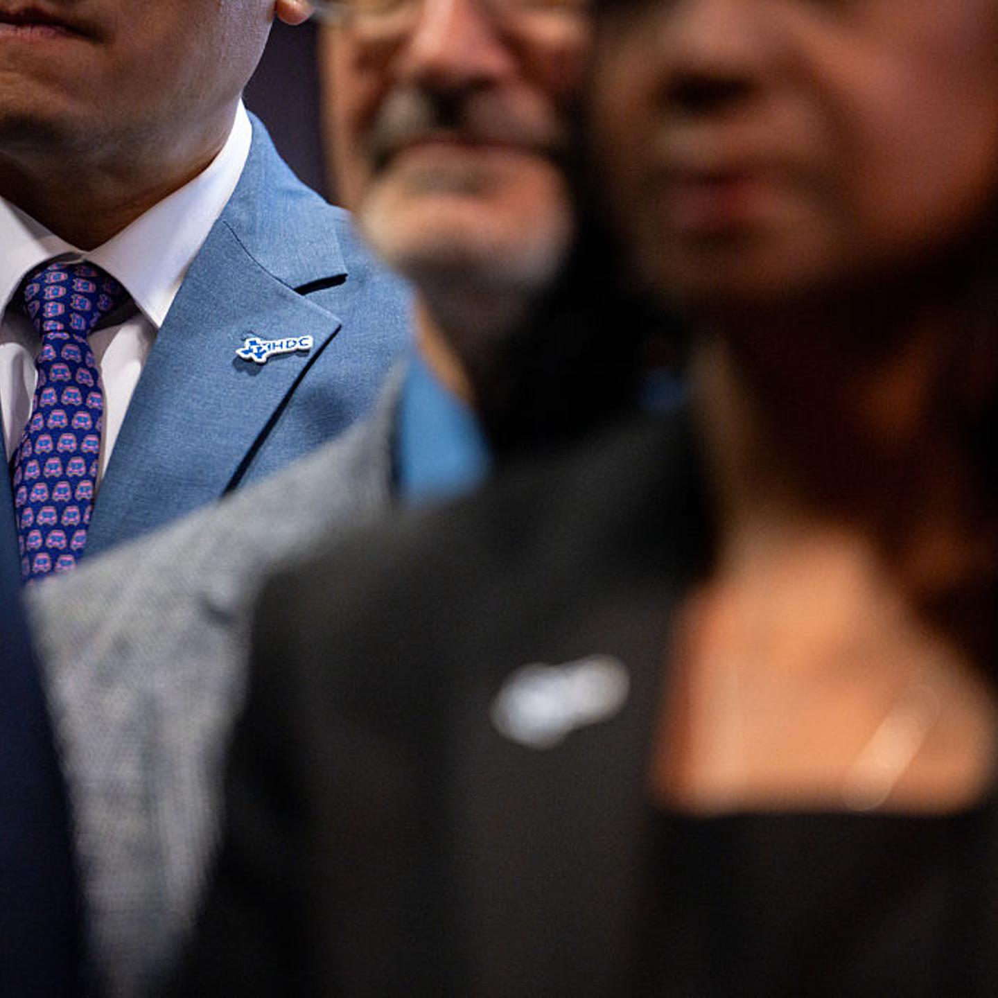 State Representative Gene Wu, a Democrat from Texas, wears a "HDC" pin during a news conference in Aurora, Ill., on Aug. 5, 2025.