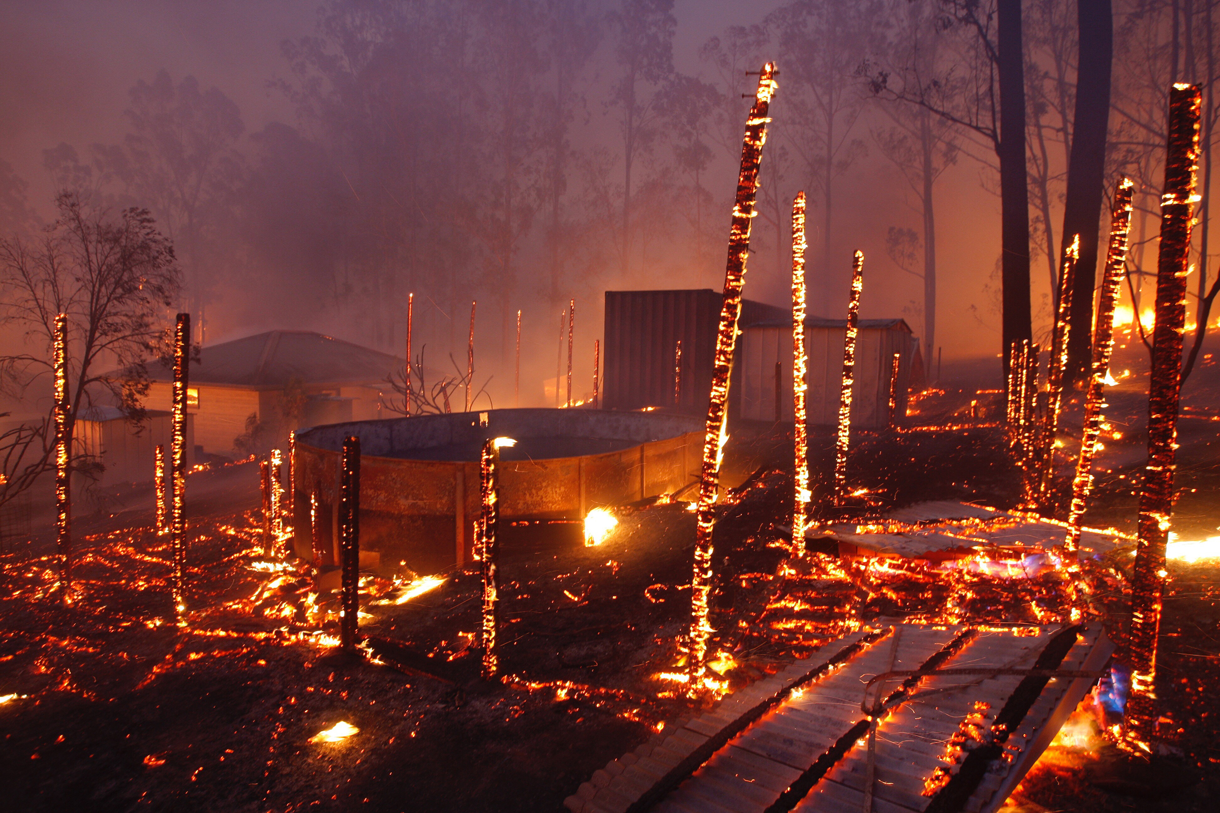 A bushfire burns through properties in the township of Rainbow Flat, New South Wales, on Nov. 9, 2019.
