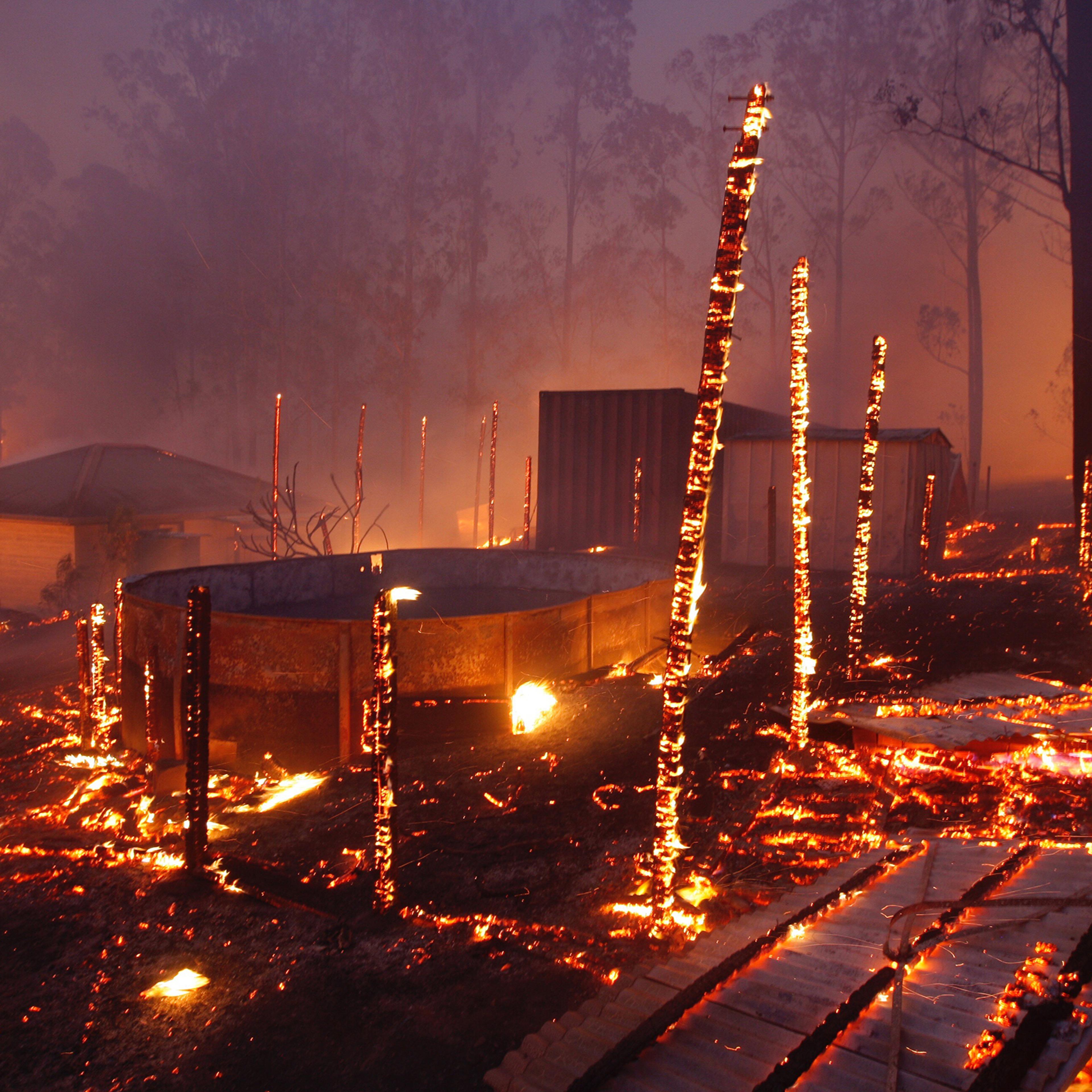 A bushfire burns through properties in the township of Rainbow Flat, New South Wales, on Nov. 9, 2019.