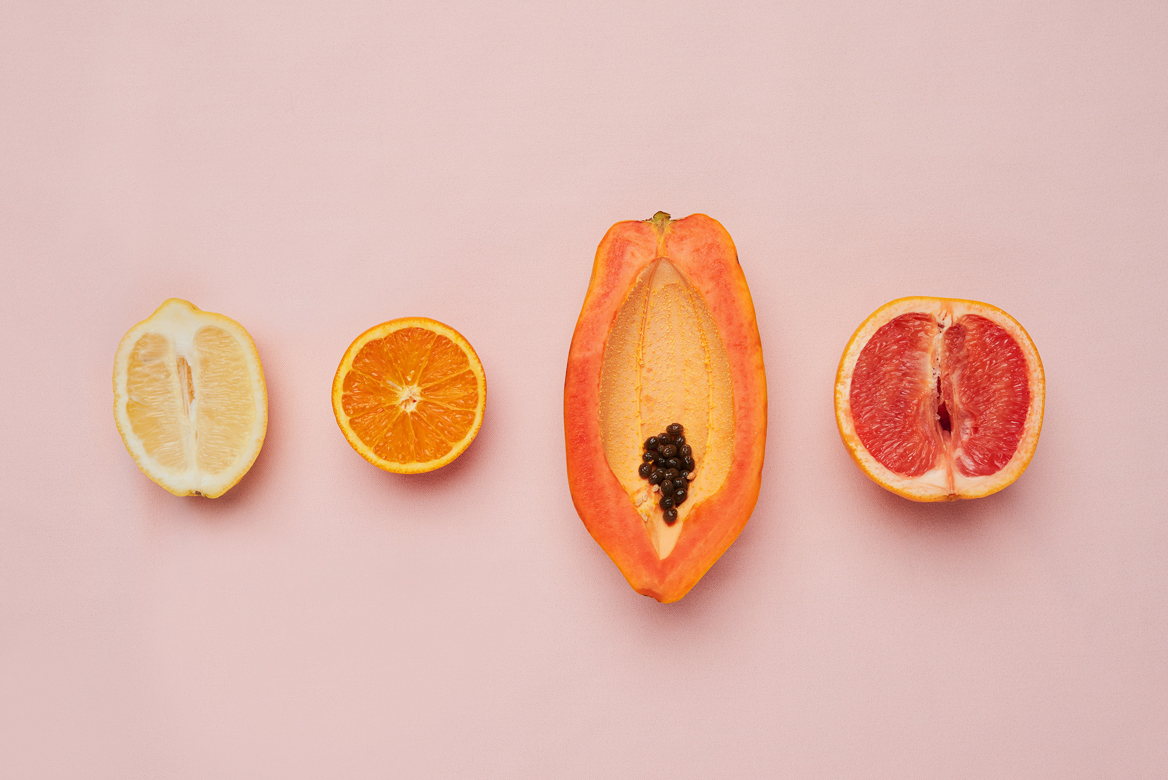 different fruit on a pink background