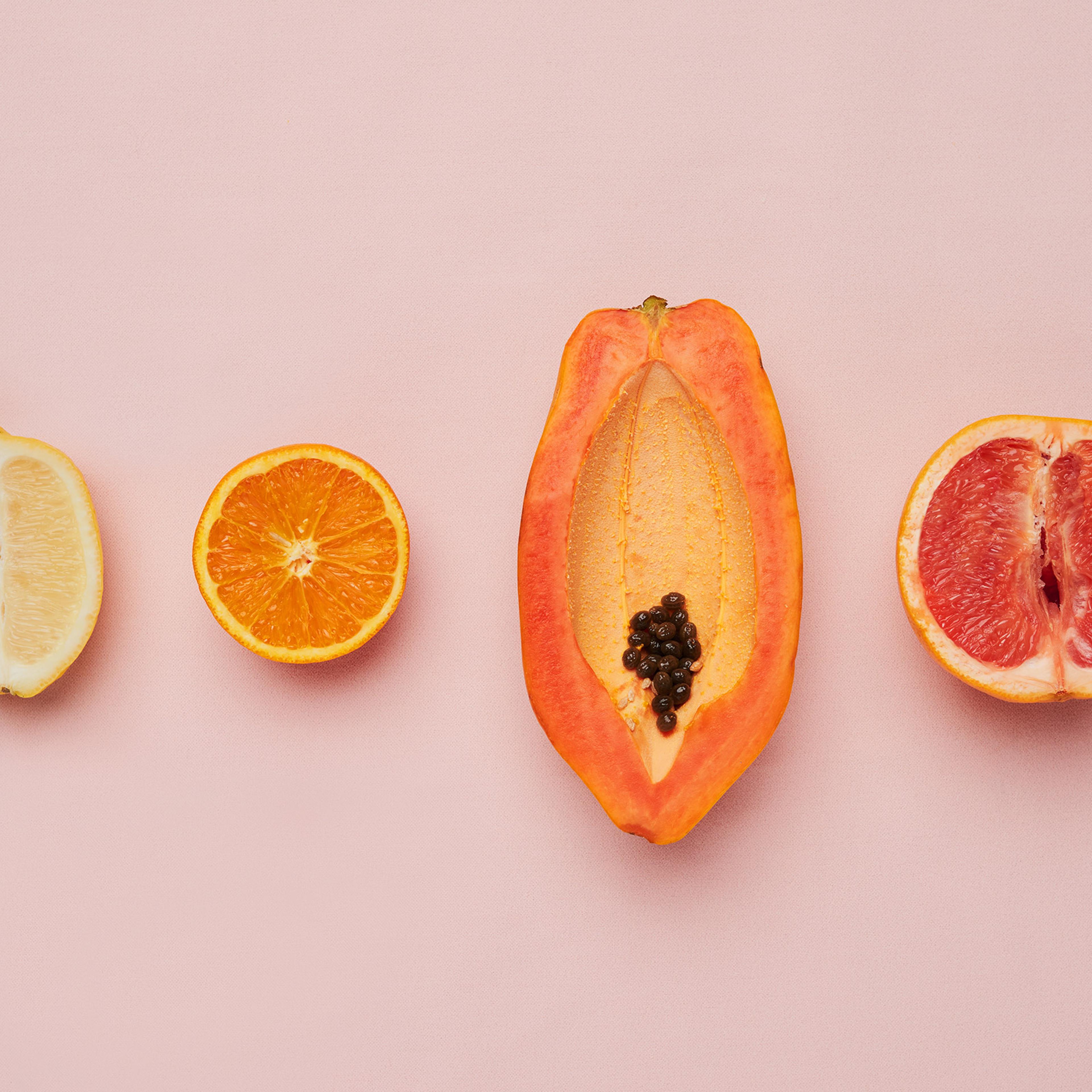 different fruit on a pink background