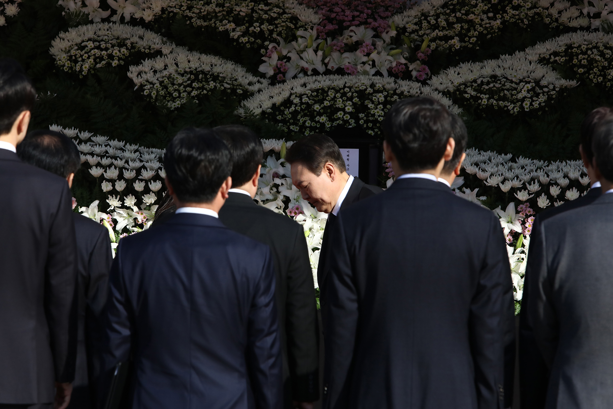South Korean President Yoon Suk-yeol visits a memorial altar for the victims of the Halloween celebration stampede, in front of City Hall on Oct. 31, 2022 in Seoul.