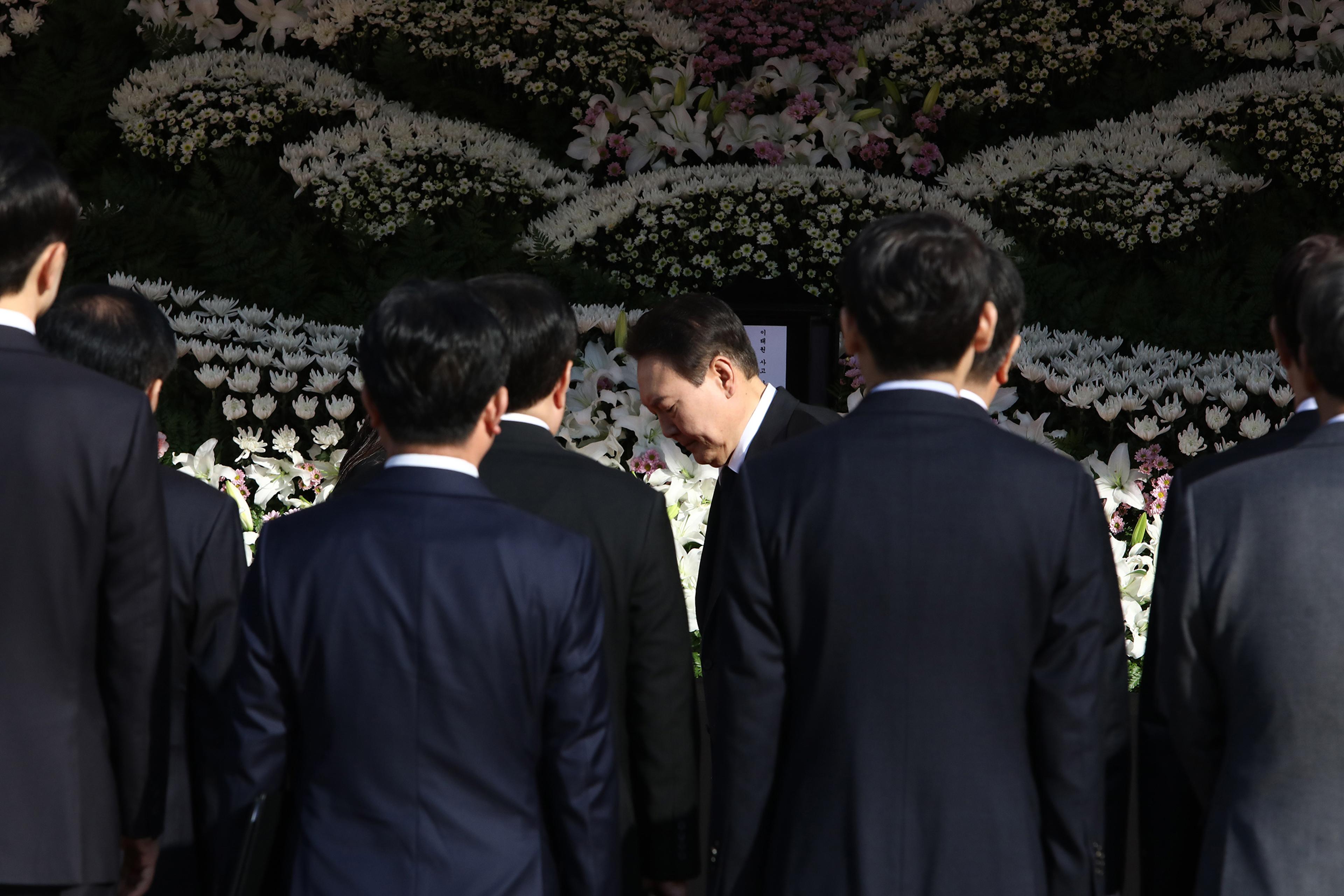 South Korean President Yoon Suk-yeol visits a memorial altar for the victims of the Halloween celebration stampede, in front of City Hall on Oct. 31, 2022 in Seoul.