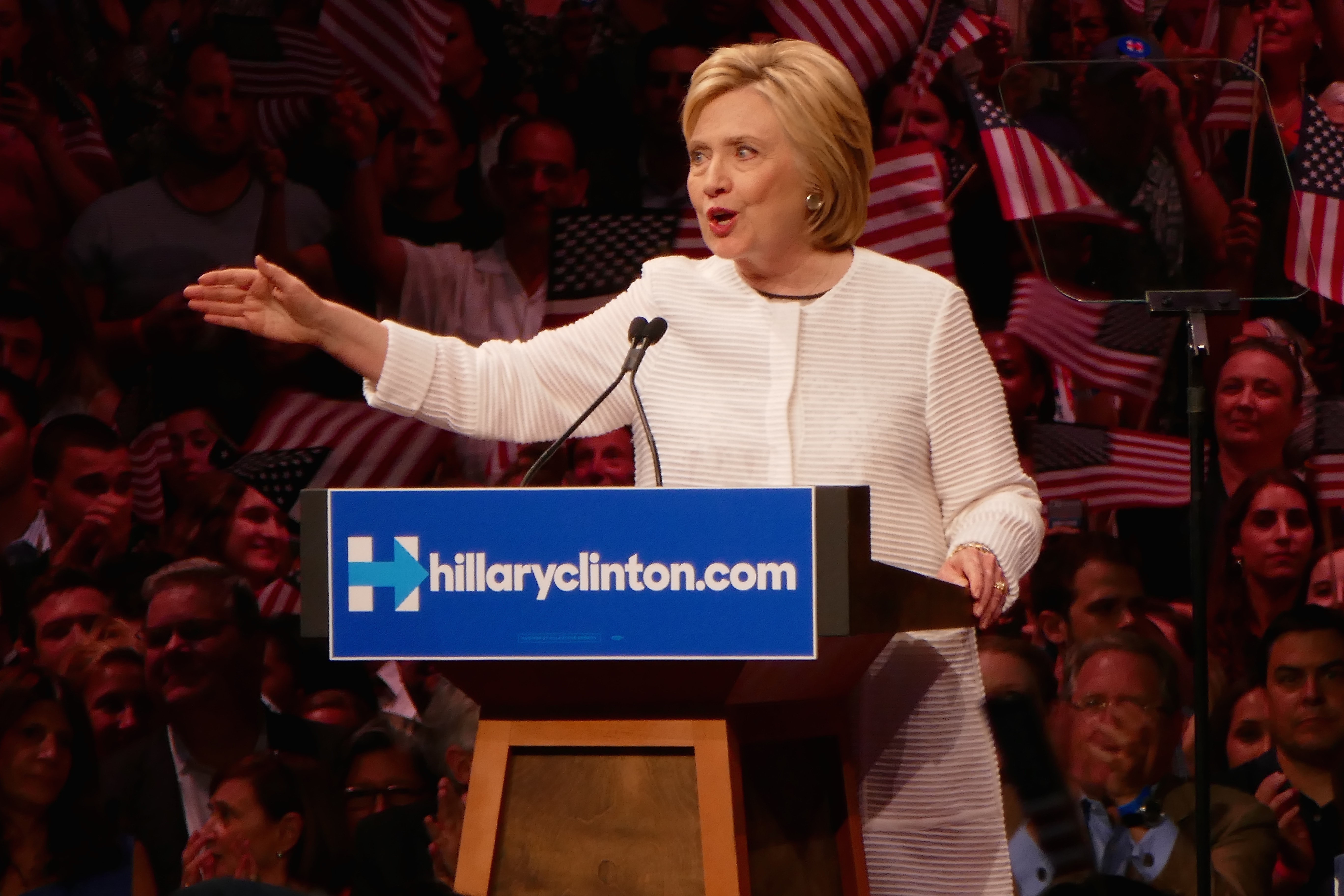 Clinton claims nomination as primaries near end
