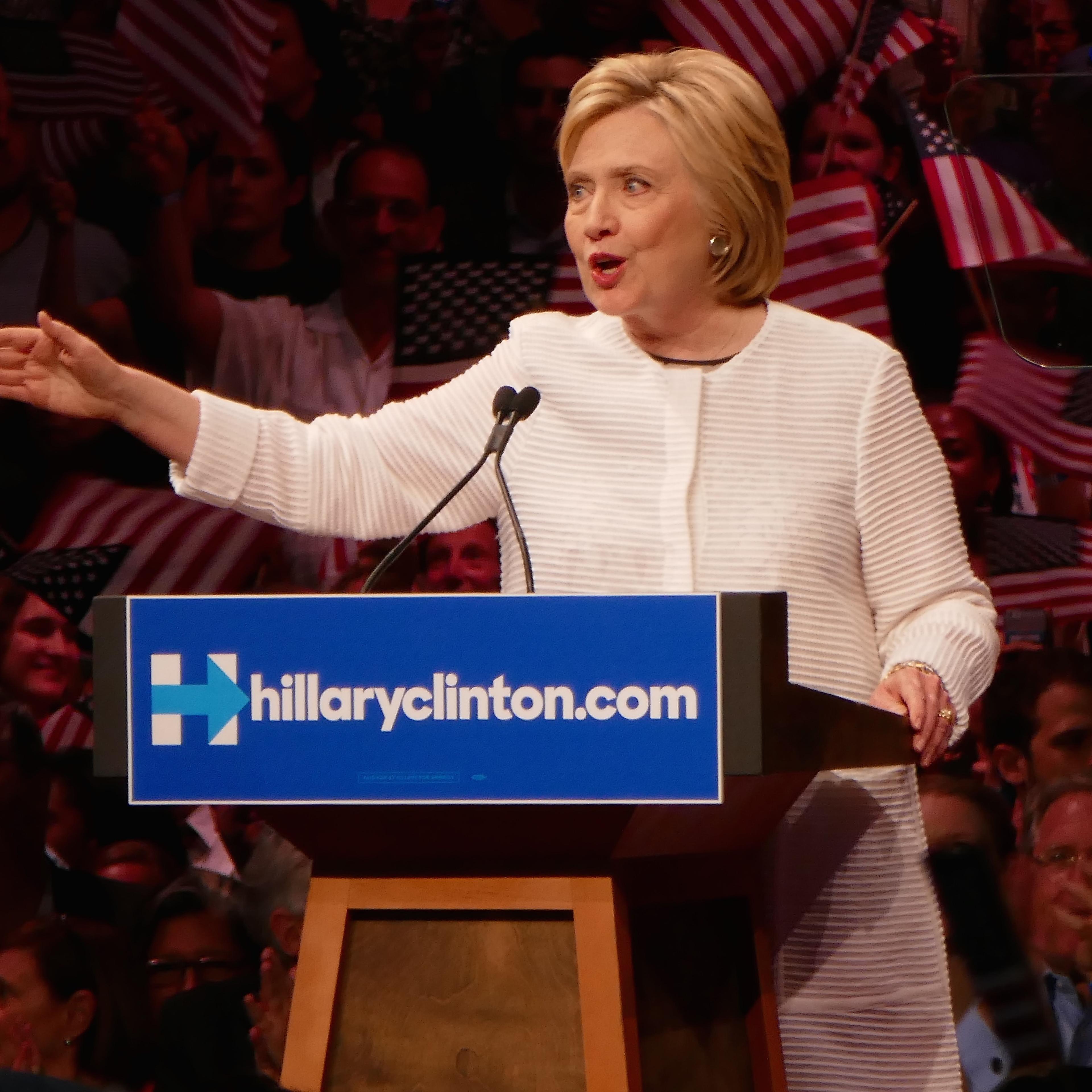 Clinton claims nomination as primaries near end