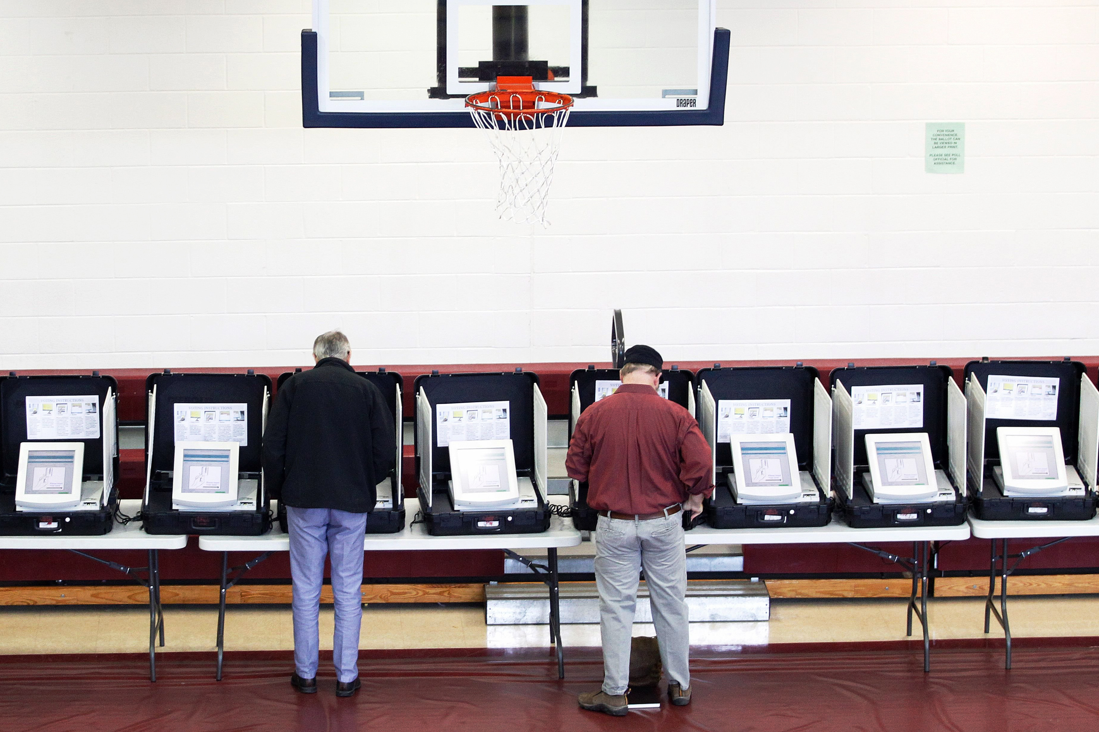 Voters place their ballots in the gymnasium at Saint Philip AME church on Super Tuesday in Atlanta.