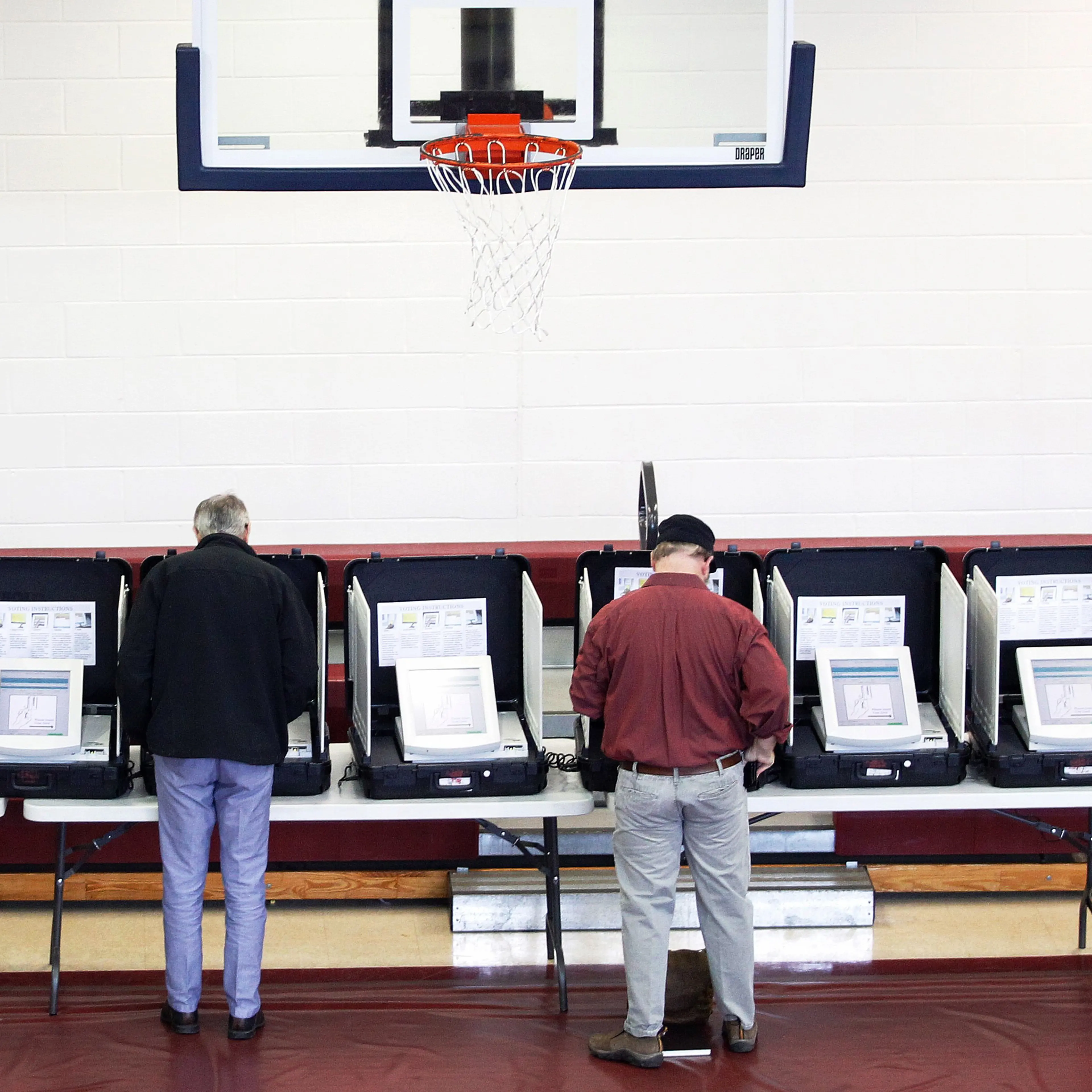 Voters place their ballots in the gymnasium at Saint Philip AME church on Super Tuesday in Atlanta.