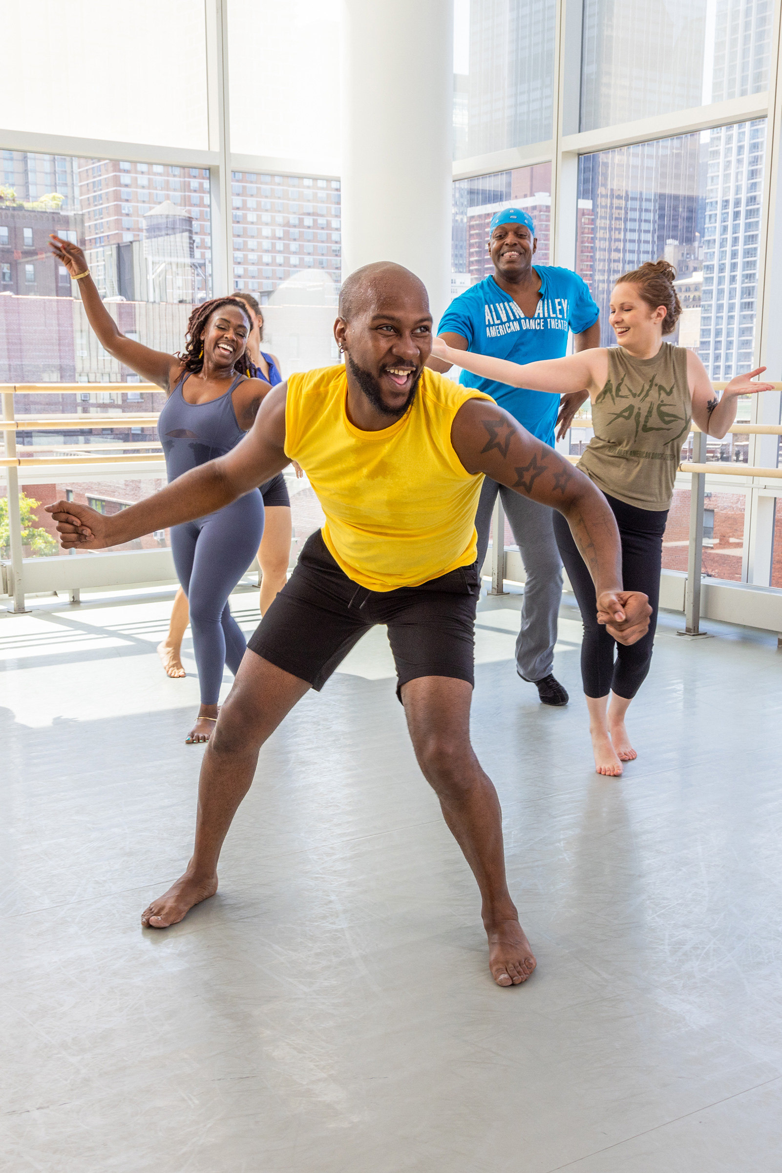 O'Shae Sibley, center, participates in an Ailey Extension dance class.