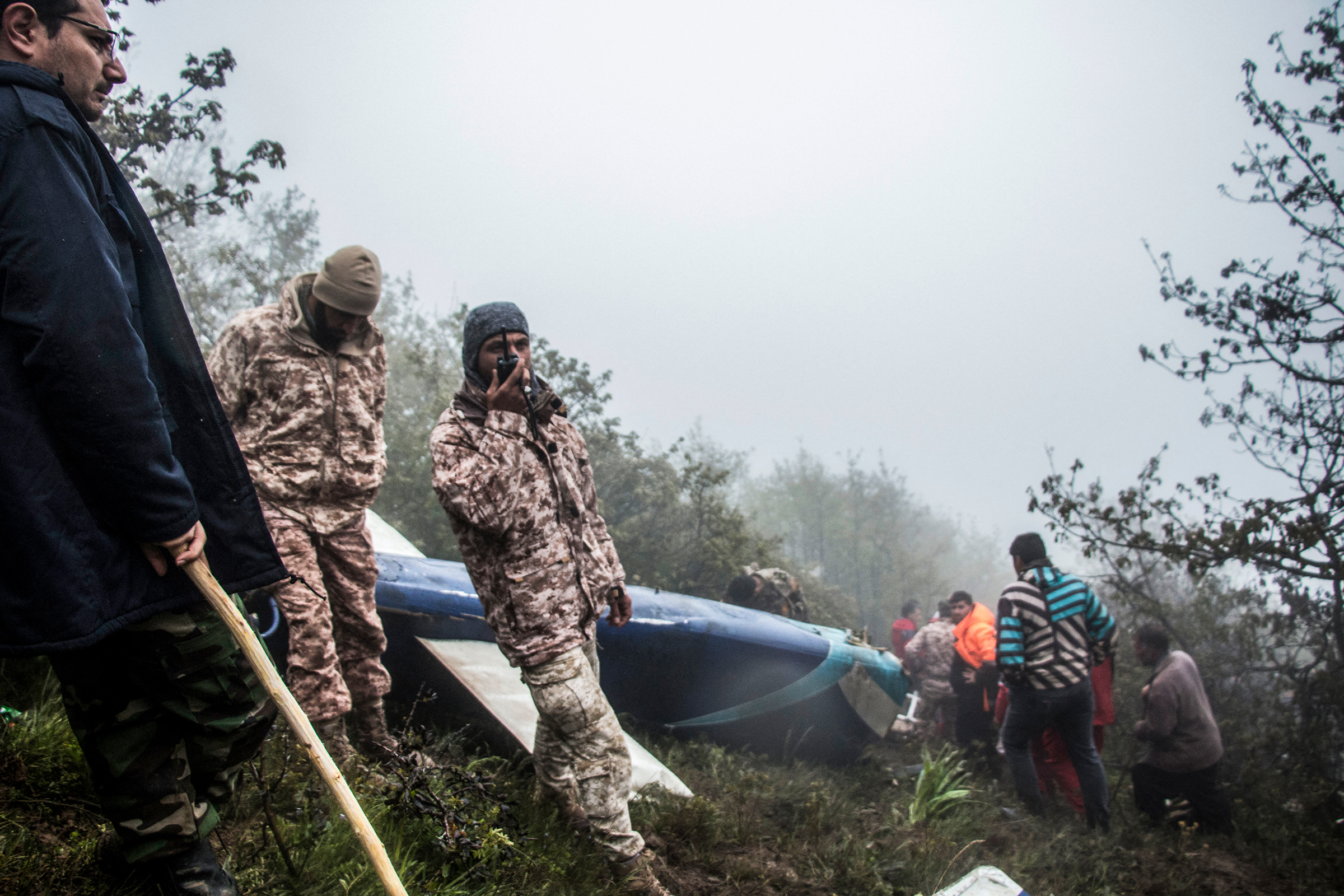 Rescue team members work at the crash site of a helicopter carrying Iranian President Ebrahim Raisi in Varzaghan, northwestern Iran, on May 20, 2024.