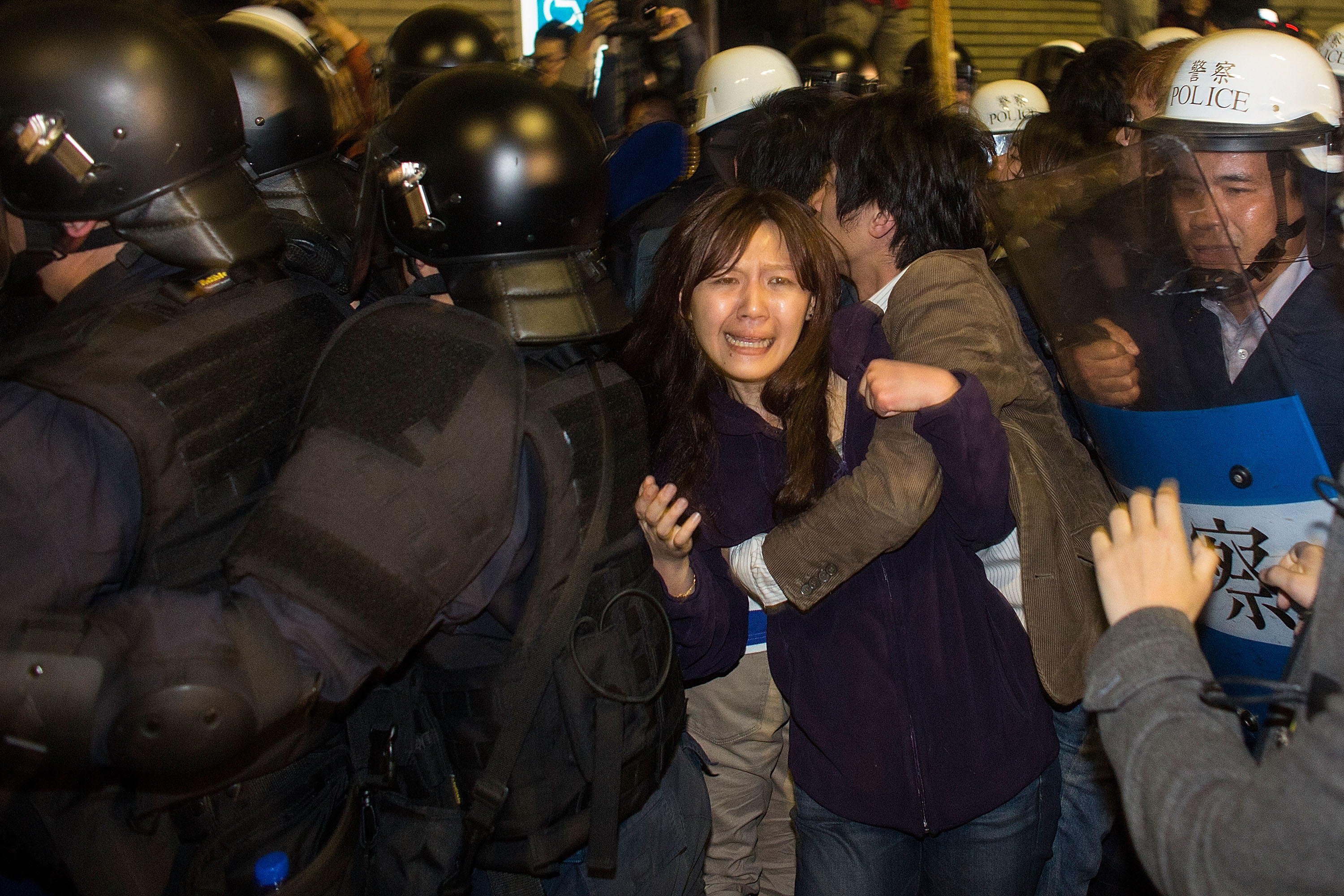 Riot police clash with student protesters outside Taiwan's cabinet offices in Taipei on March 24, 2014. Clashes erupted after Taiwan's President refused to scrap a contentious trade agreement with China and denounced the "illegal" occupation of governmen