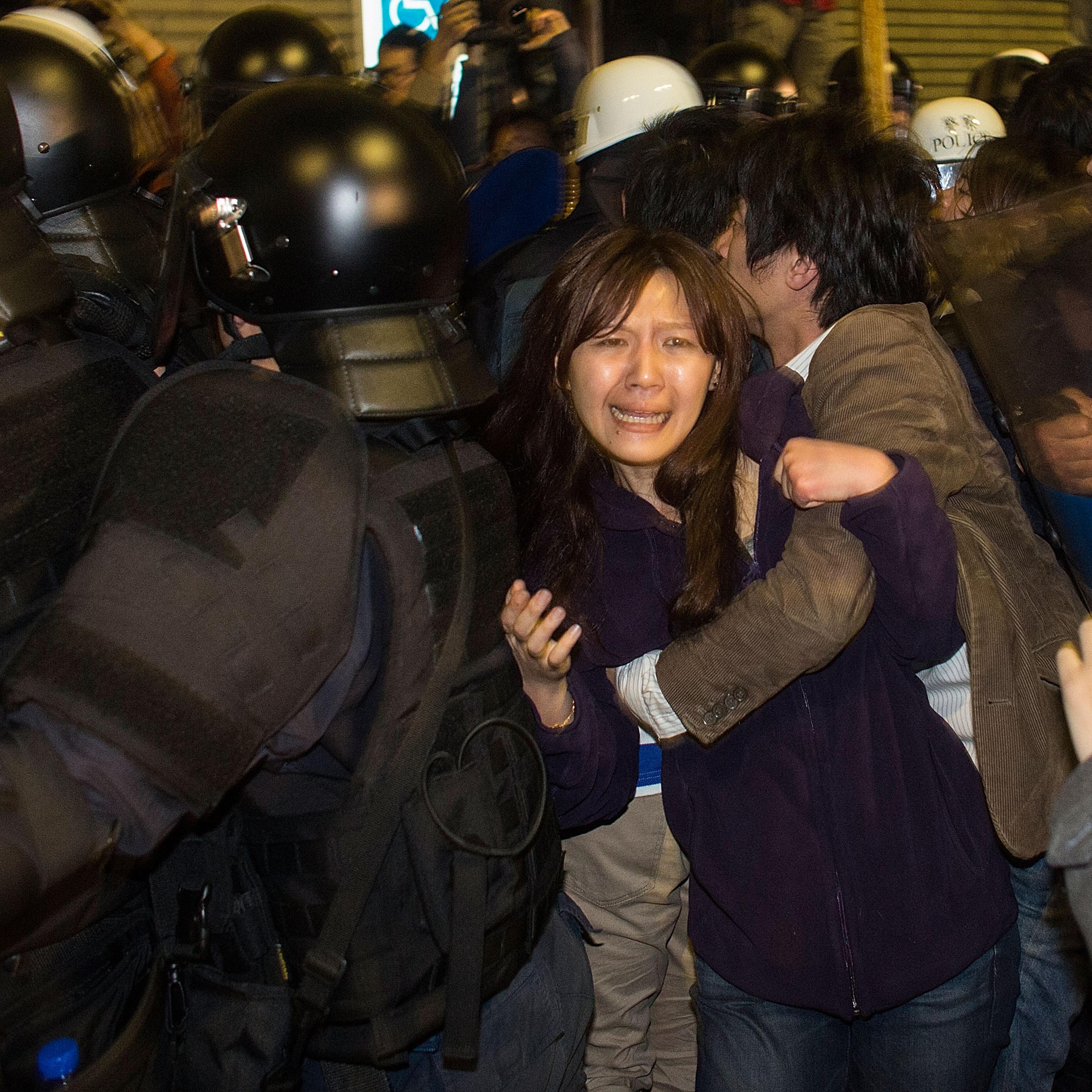 Riot police clash with student protesters outside Taiwan's cabinet offices in Taipei on March 24, 2014. Clashes erupted after Taiwan's President refused to scrap a contentious trade agreement with China and denounced the "illegal" occupation of governmen
