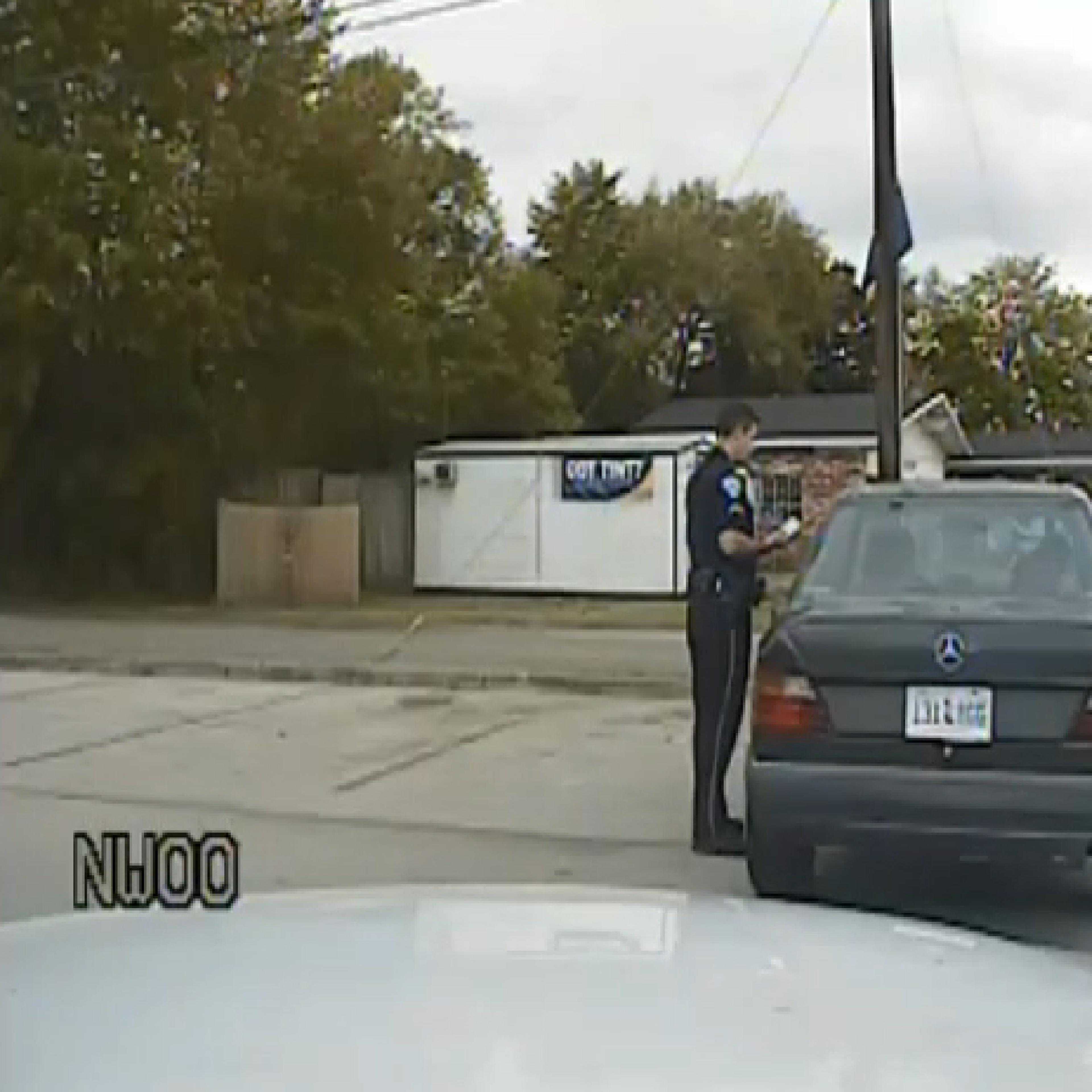 Officer Michael Slager reviews Walter Scott's Drivers License in North Charleston, S.C. on April 4, 2015.