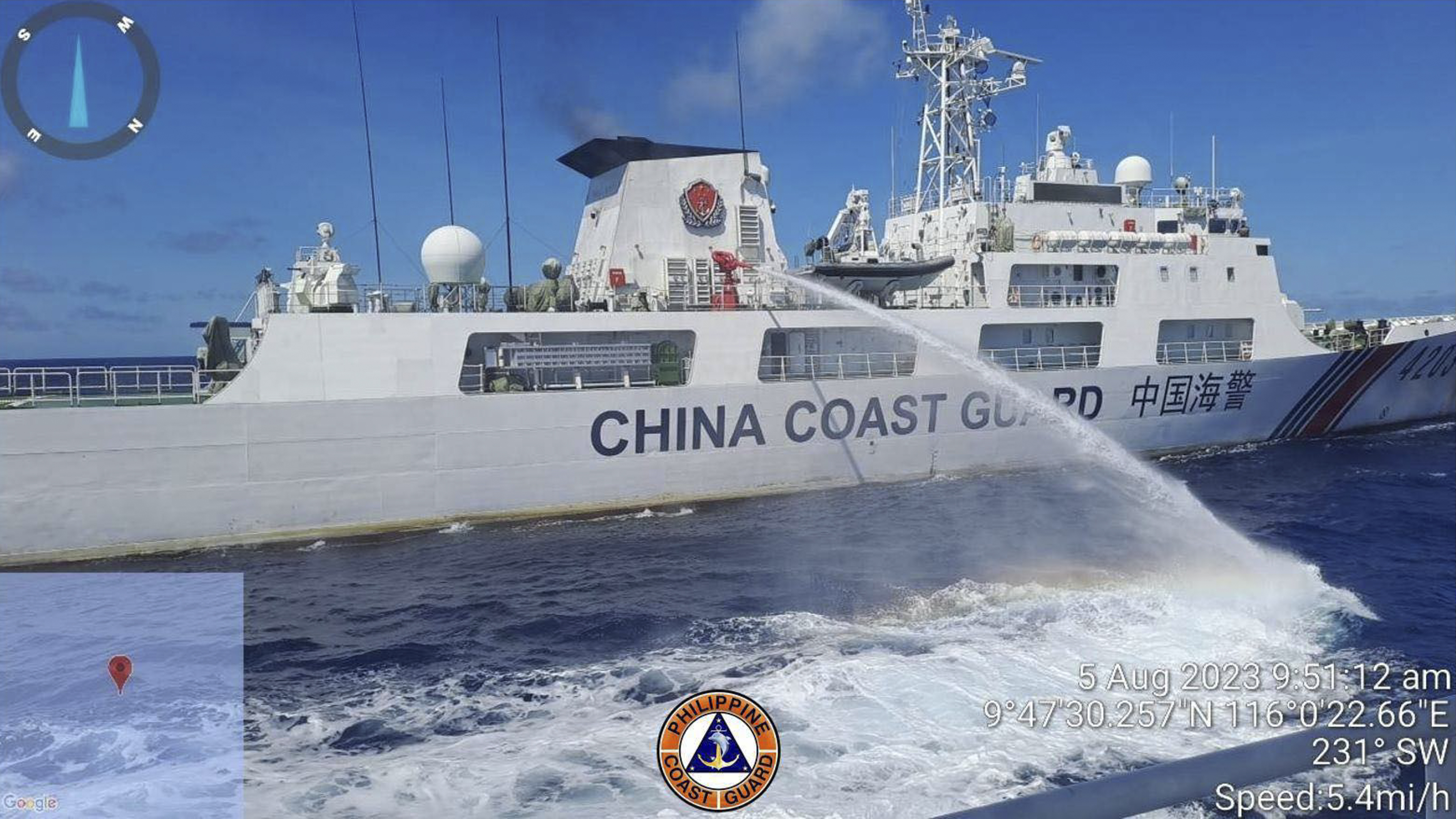 In this handout photo provided by the Philippine Coast Guard, a Chinese coast guard ship uses water canons on a Philippine Coast Guard ship near the Philippine-occupied Second Thomas Shoal, South China Sea as they blocked it's path during a re-supply mis