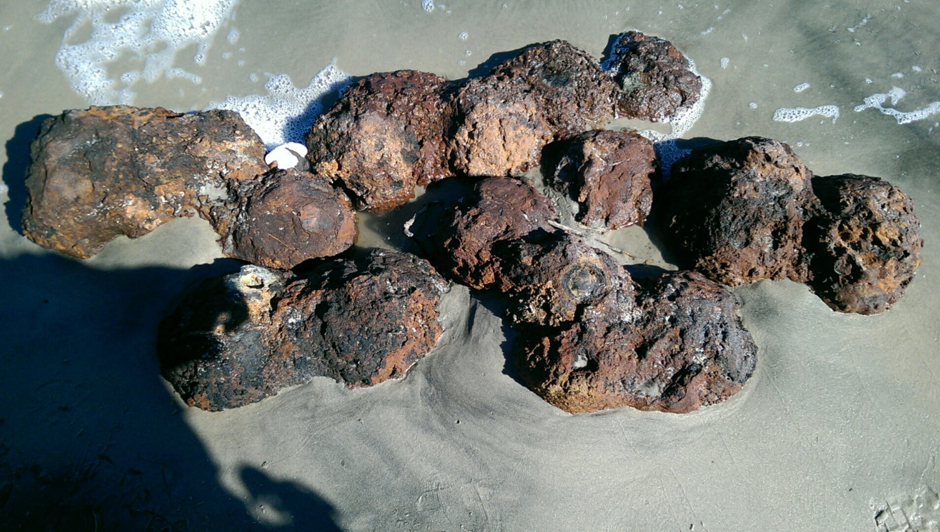 Civil War-era canon balls are uncovered after Hurricane Matthew in in South Carolina, Folly Beach, on Oct. 9, 2016