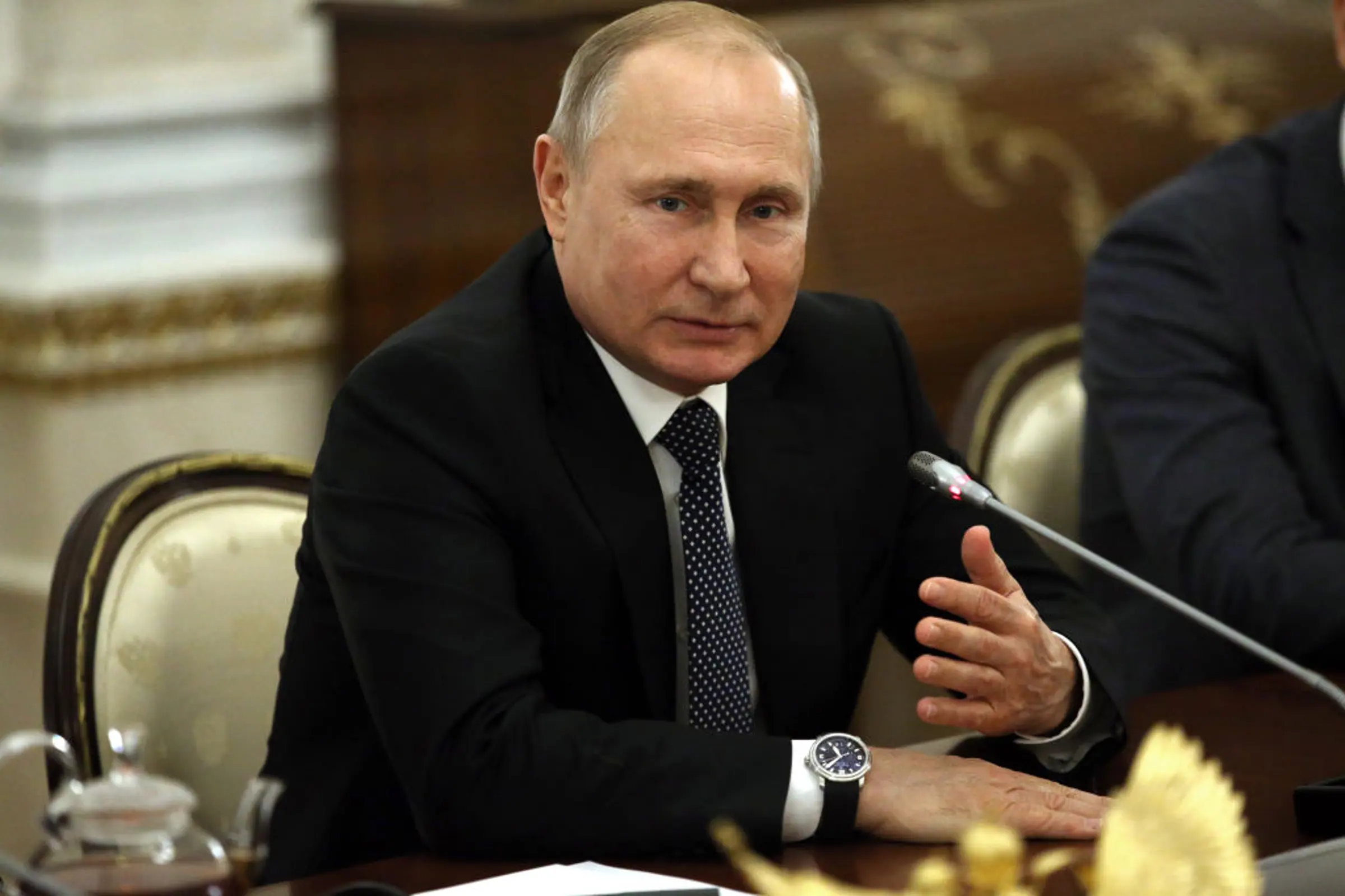 Russian President Vladimir Putin talks during his informal meeting with the 'Leaders of Russia' contest winners at the Kremlin