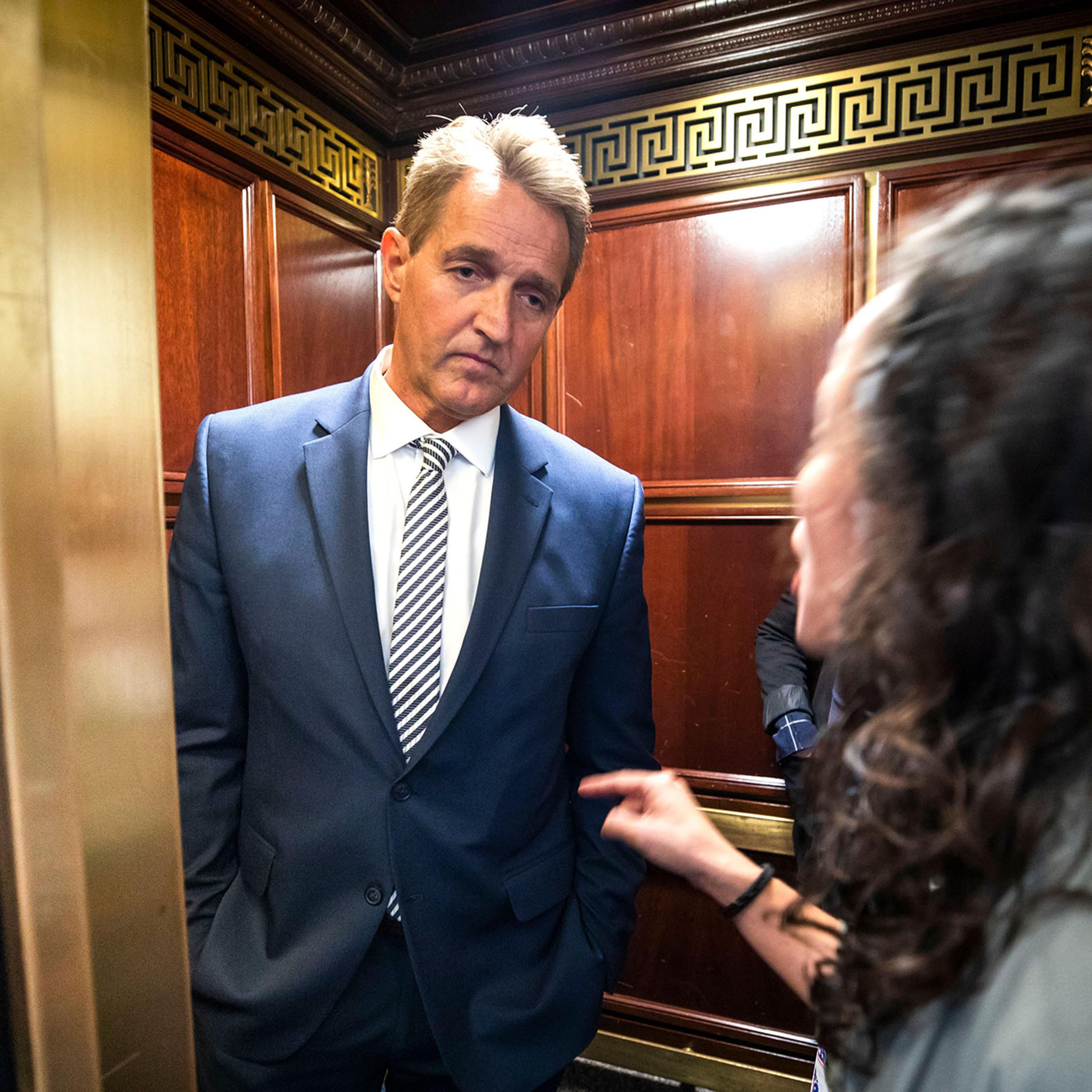 A woman who said she is a survivor of a sexual assault confronts Republican Senator from Arizona Jeff Flake in an elevator after Flake announced that he vote to confirm Supreme Court nominee Brett Kavanaugh on Sept. 28, 2018.