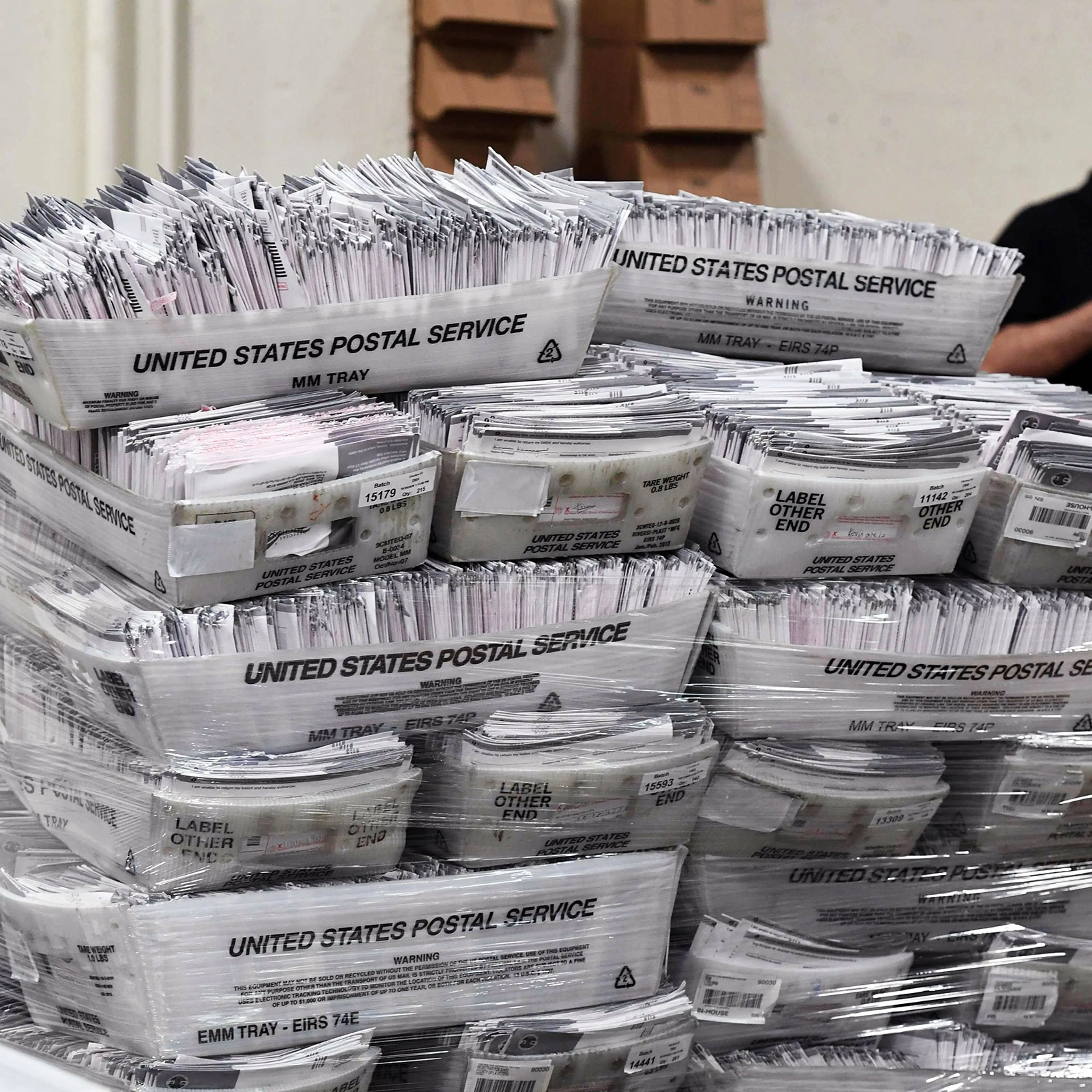 Mail-in ballots in their envelopes await processing at the Los Angeles County Registrar Recorders' mail-in ballot processing center in Pomona, Calif., On Oct. 28, 2020.