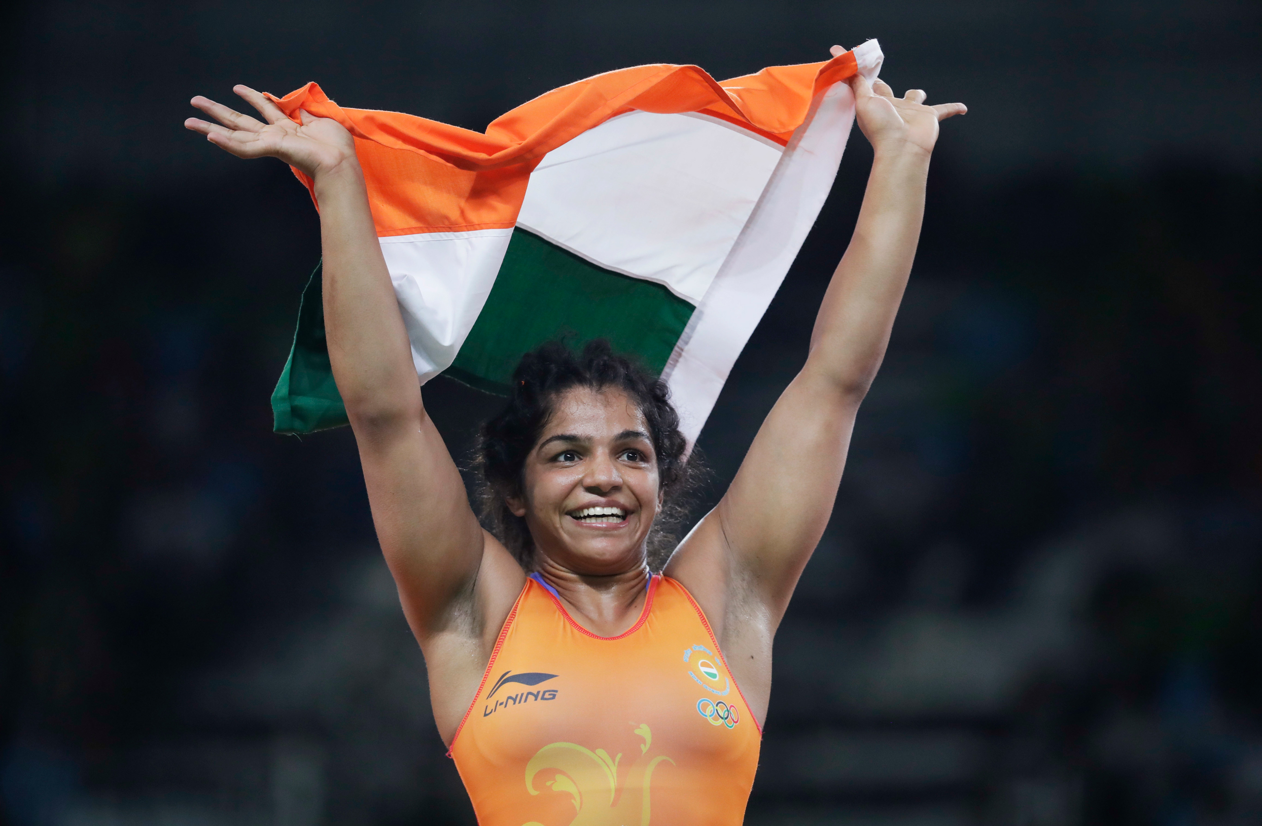 India's Sakshi Malik reacts after winning bronze against Kyrgyzstan's Aisuluu Tynybekova in the women's wrestling freestyle 58-kg competition at the 2016 Summer Olympics in Rio de Janeiro, Brazil, Wednesday, Aug. 17, 2016. (AP Photo/Markus Schreiber)