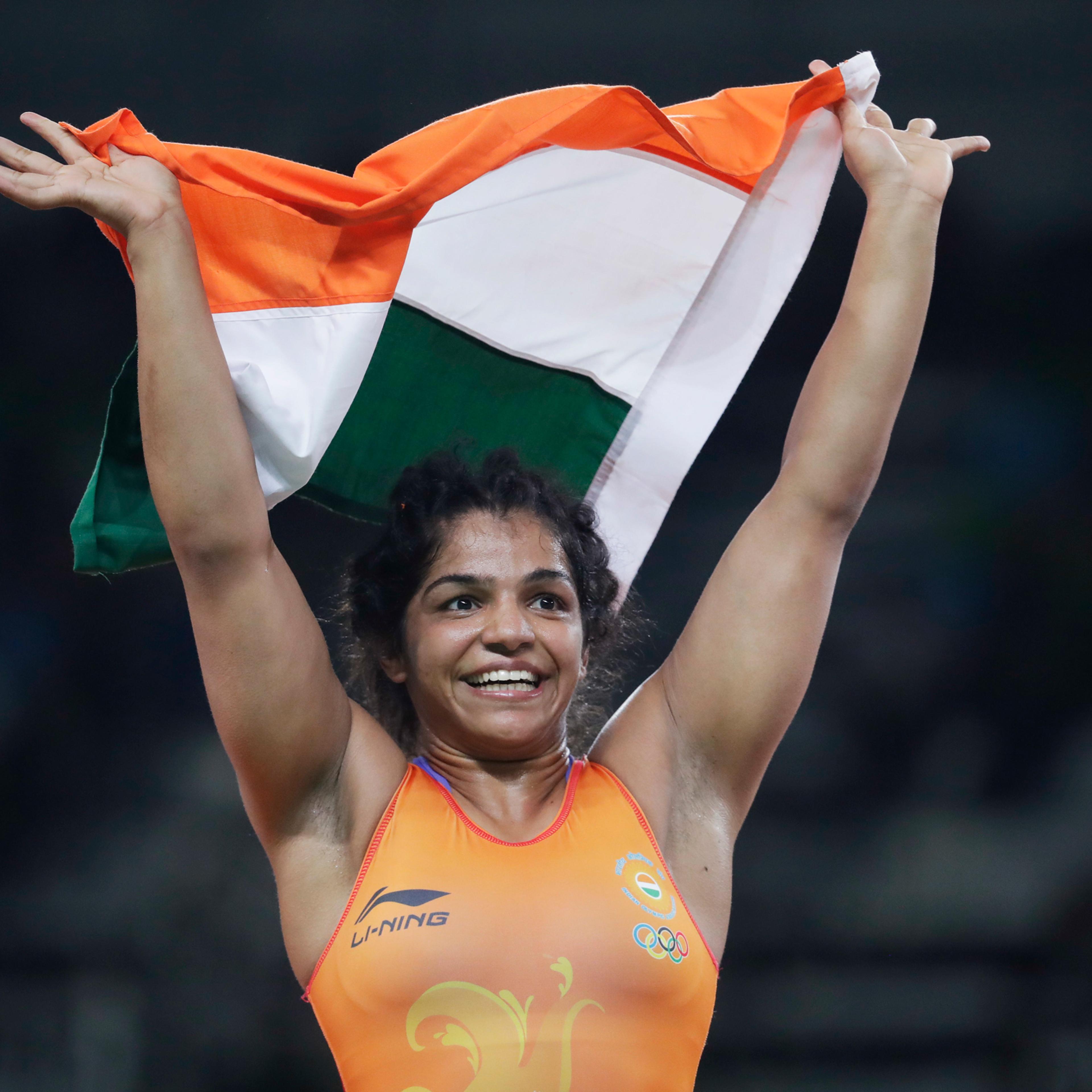 India's Sakshi Malik reacts after winning bronze against Kyrgyzstan's Aisuluu Tynybekova in the women's wrestling freestyle 58-kg competition at the 2016 Summer Olympics in Rio de Janeiro, Brazil, Wednesday, Aug. 17, 2016. (AP Photo/Markus Schreiber)