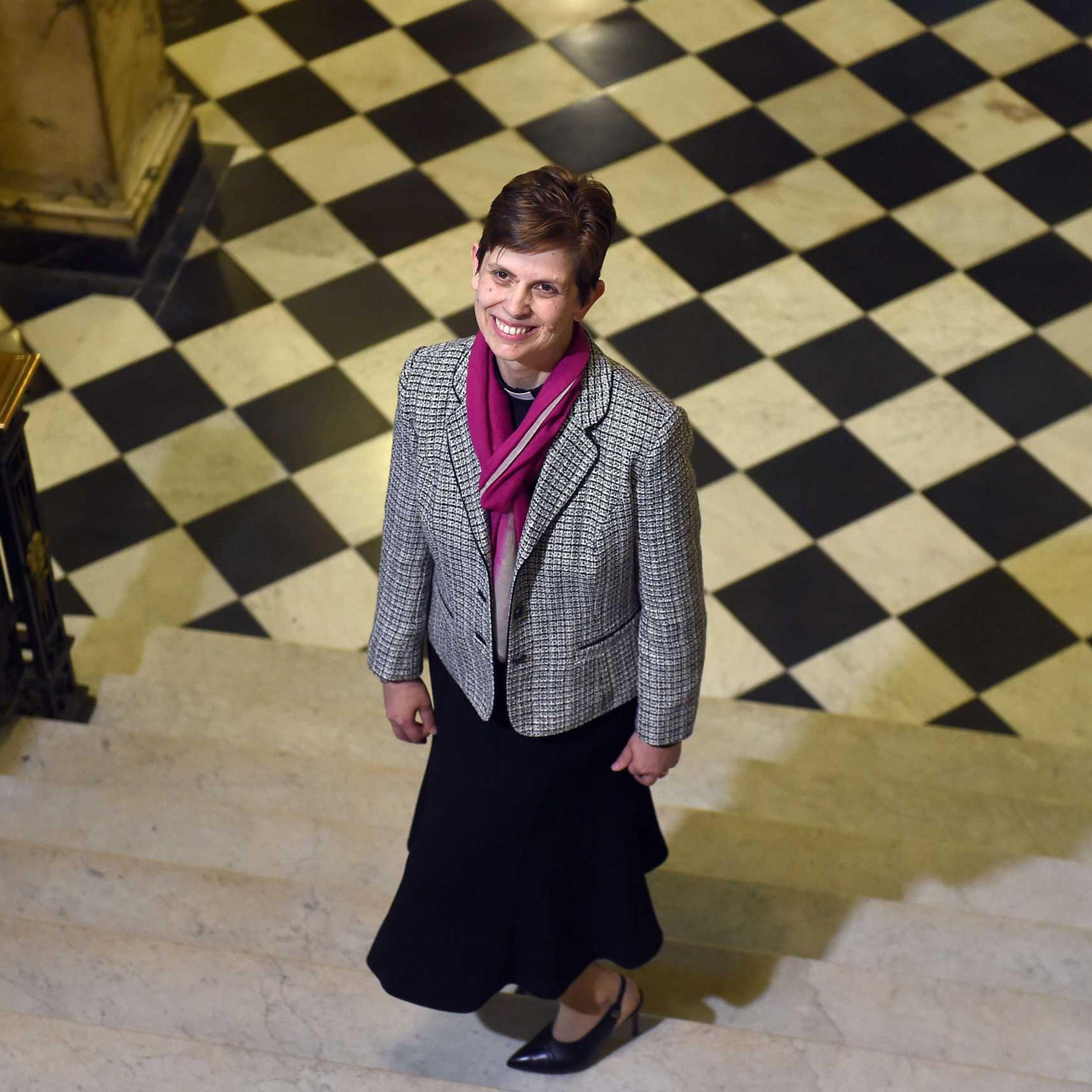 Reverend Libby Lane poses for pictures during a photo call following the announcement naming her first woman bishop by The Church of England, after a historic change in its rules, in Stockport, northwest England, on Dec. 17, 2014.