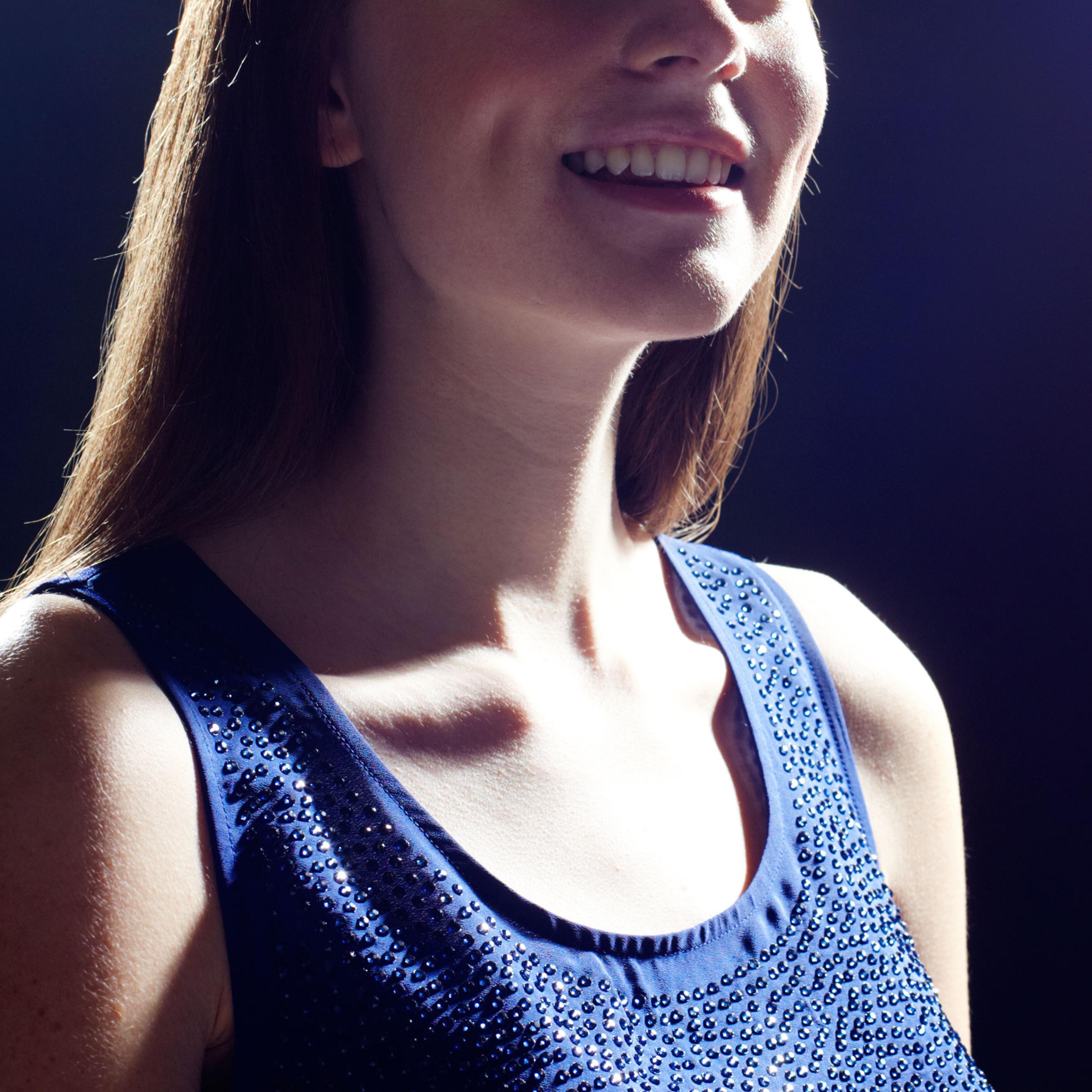 Young woman looking up.