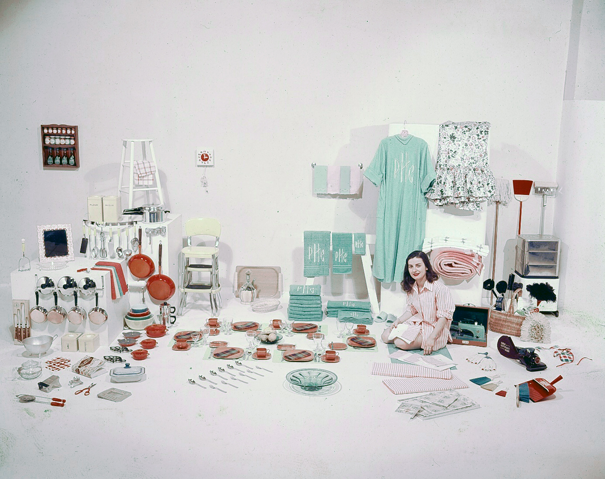 Bride's four showers. With this practical haul Peggy Cross is set to keep house.