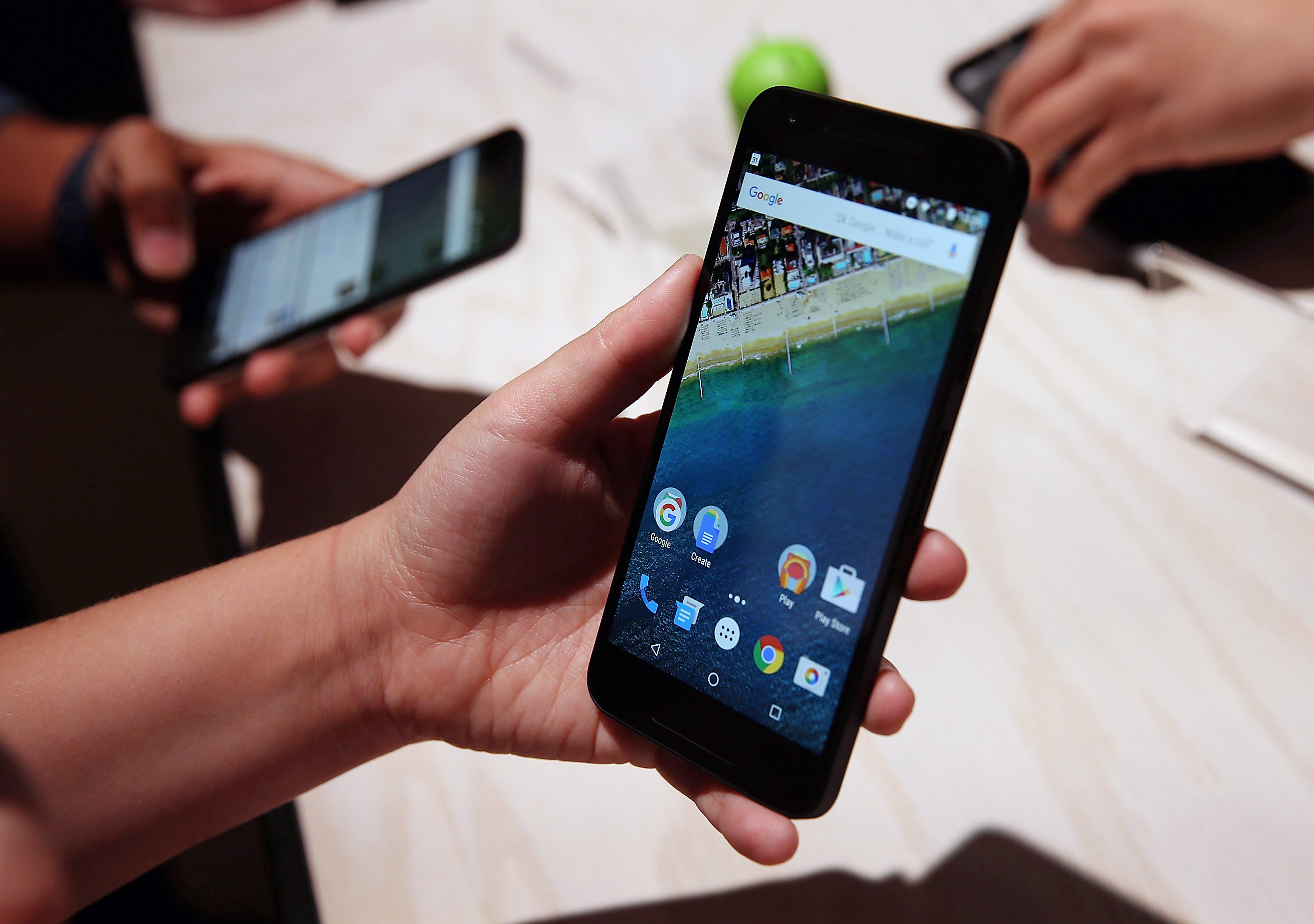 SAN FRANCISCO, CA - SEPTEMBER 29:  An attendee inspects the new Nexus 5X phone during a Google media event on September 29, 2015 in San Francisco, California. Google unveiled its 2015 smartphone lineup, the Nexus 5x and Nexus 6P, the new Chromecast and n