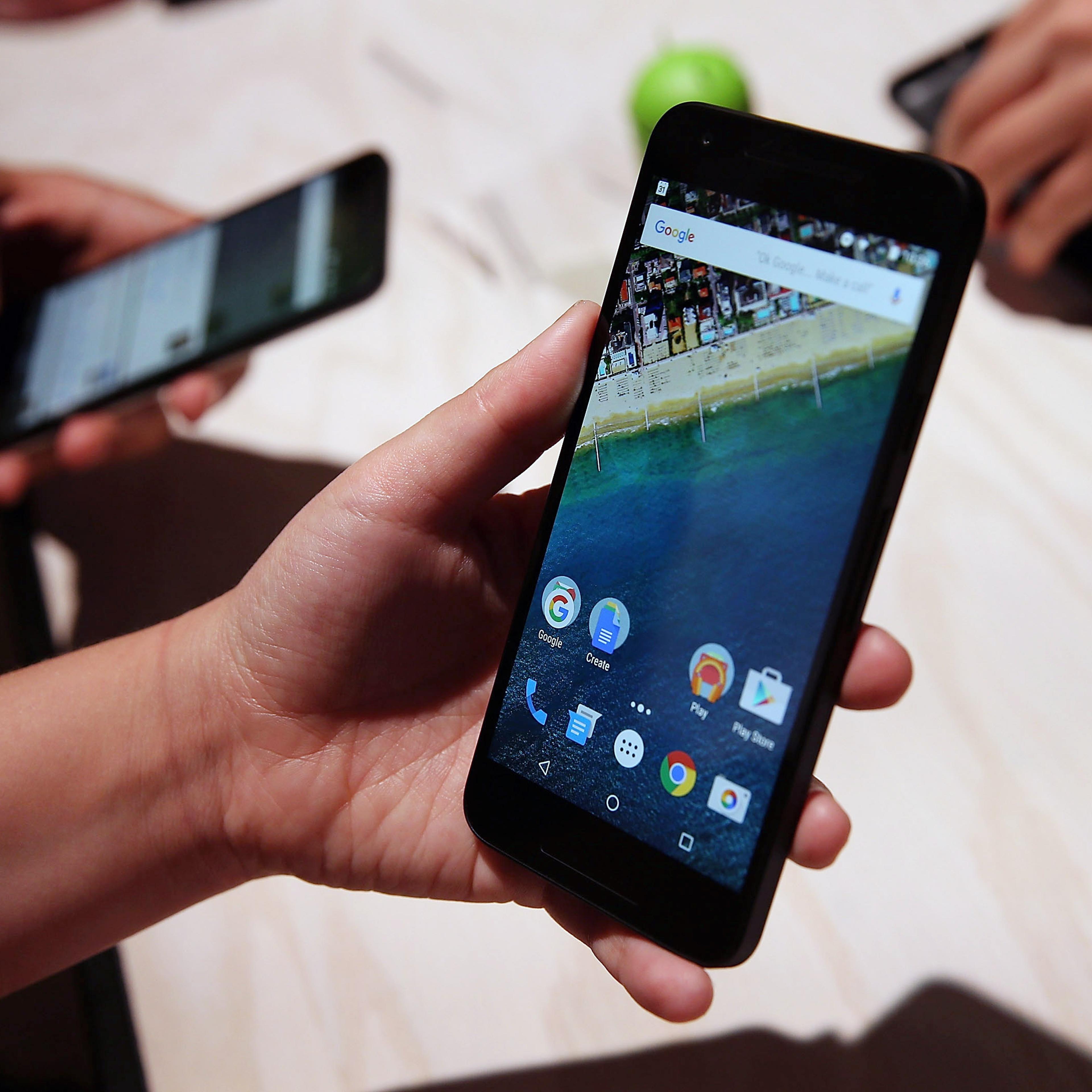 SAN FRANCISCO, CA - SEPTEMBER 29: An attendee inspects the new Nexus 5X phone during a Google media event on September 29, 2015 in San Francisco, California. Google unveiled its 2015 smartphone lineup, the Nexus 5x and Nexus 6P, the new Chromecast and n