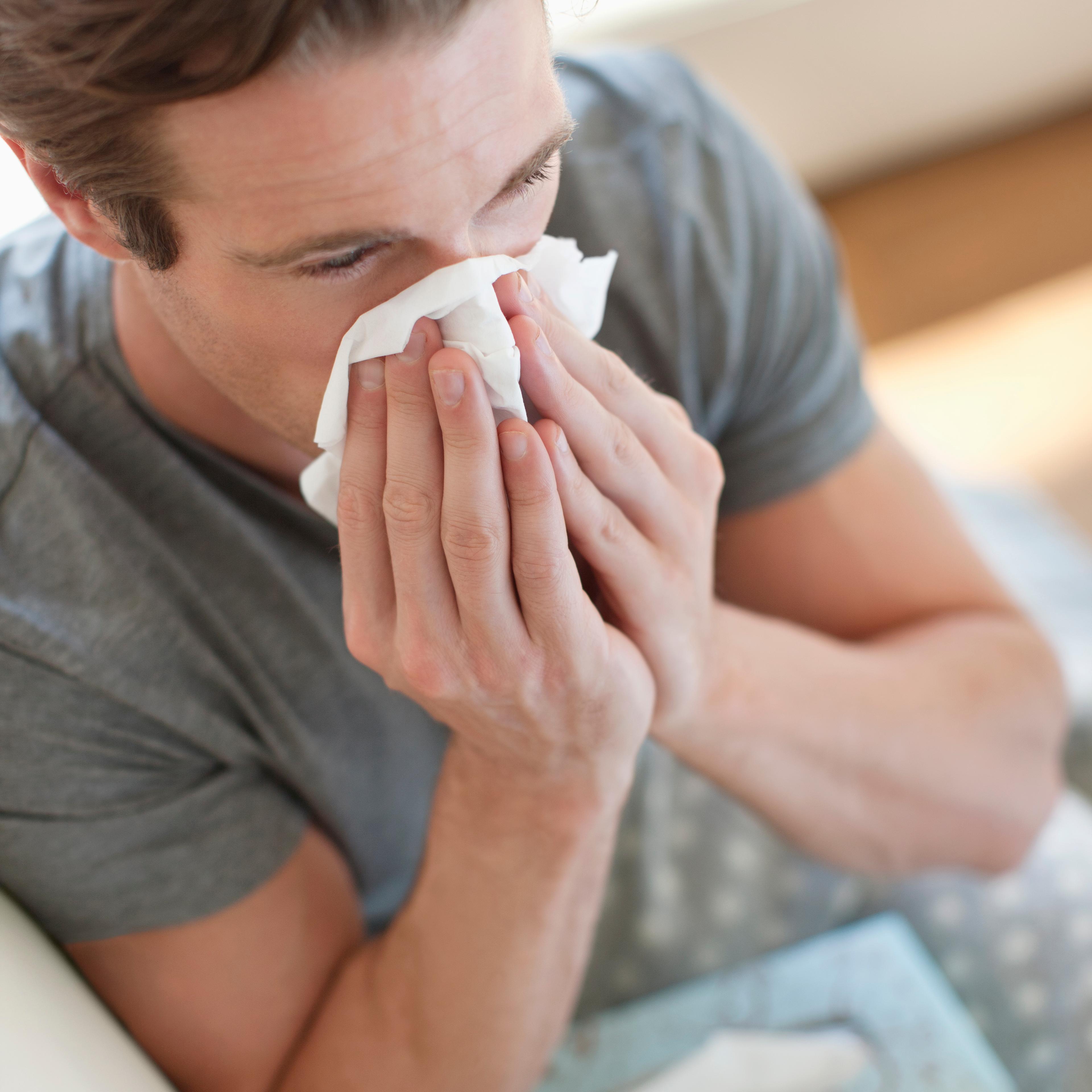 man-blowing-nose