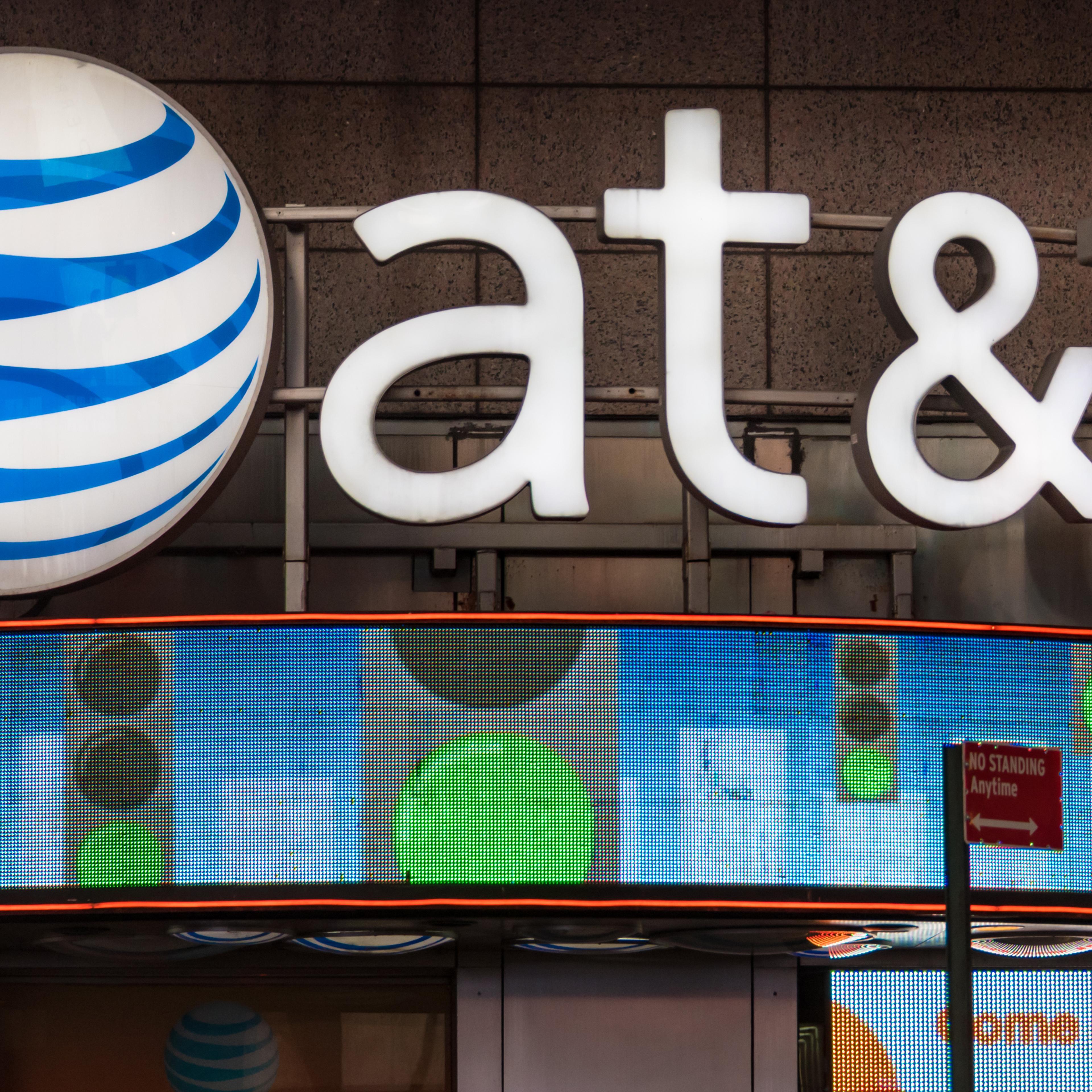 AT&T office New York City, USA: Signage and logo outside its office glowing at night. AT&T Inc. is an American multinational telecommunications corporation, headquartered at Whitacre Tower in downtown Dallas, Texas. (Photo by Roberto Machado Noa/Ligh
