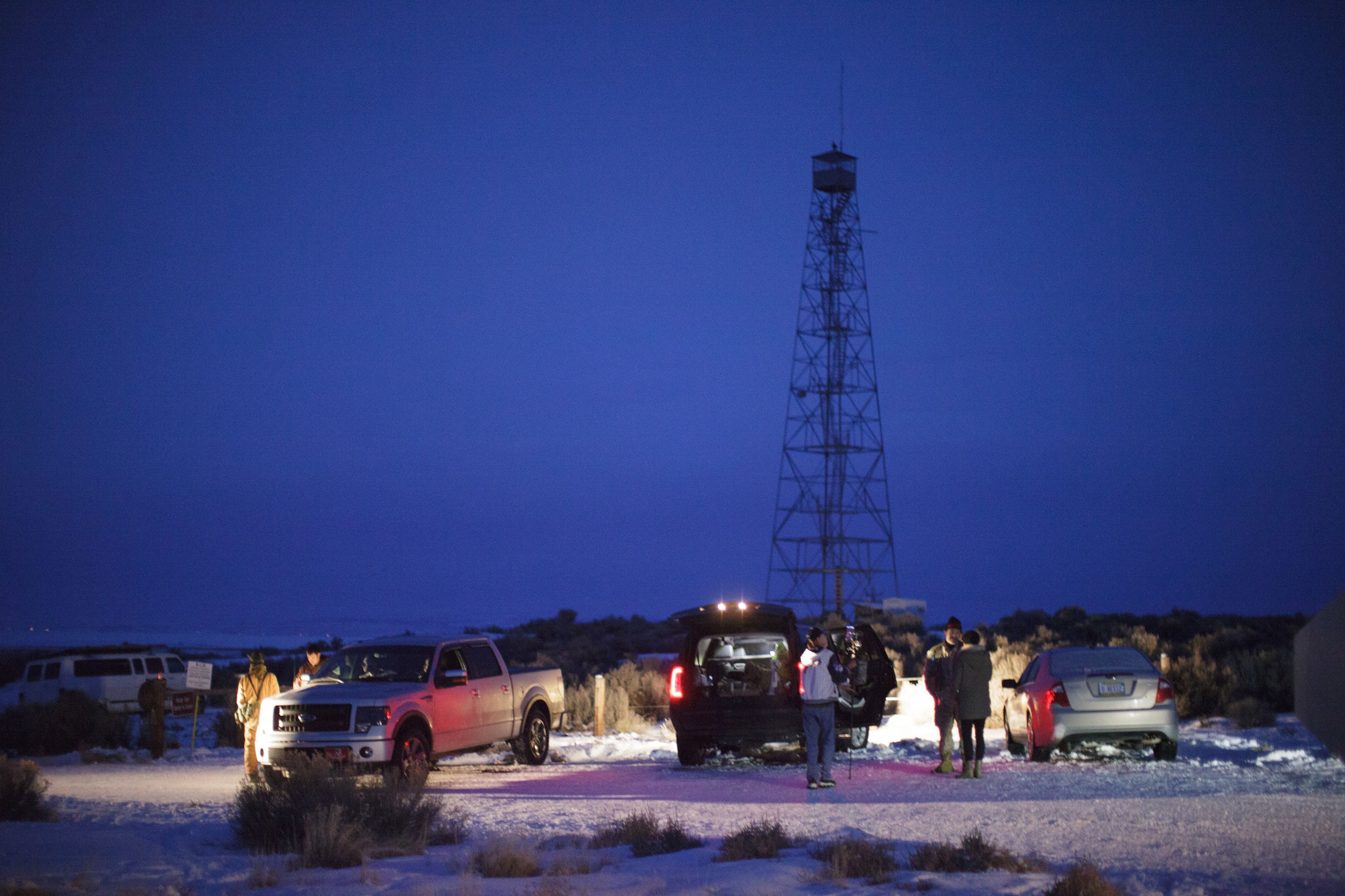 Members of a small militia at the entrance to the Malheur Wildlife Refuge Headquarters property some 30 miles from Burns, Ore., Jan. 3, 2016.