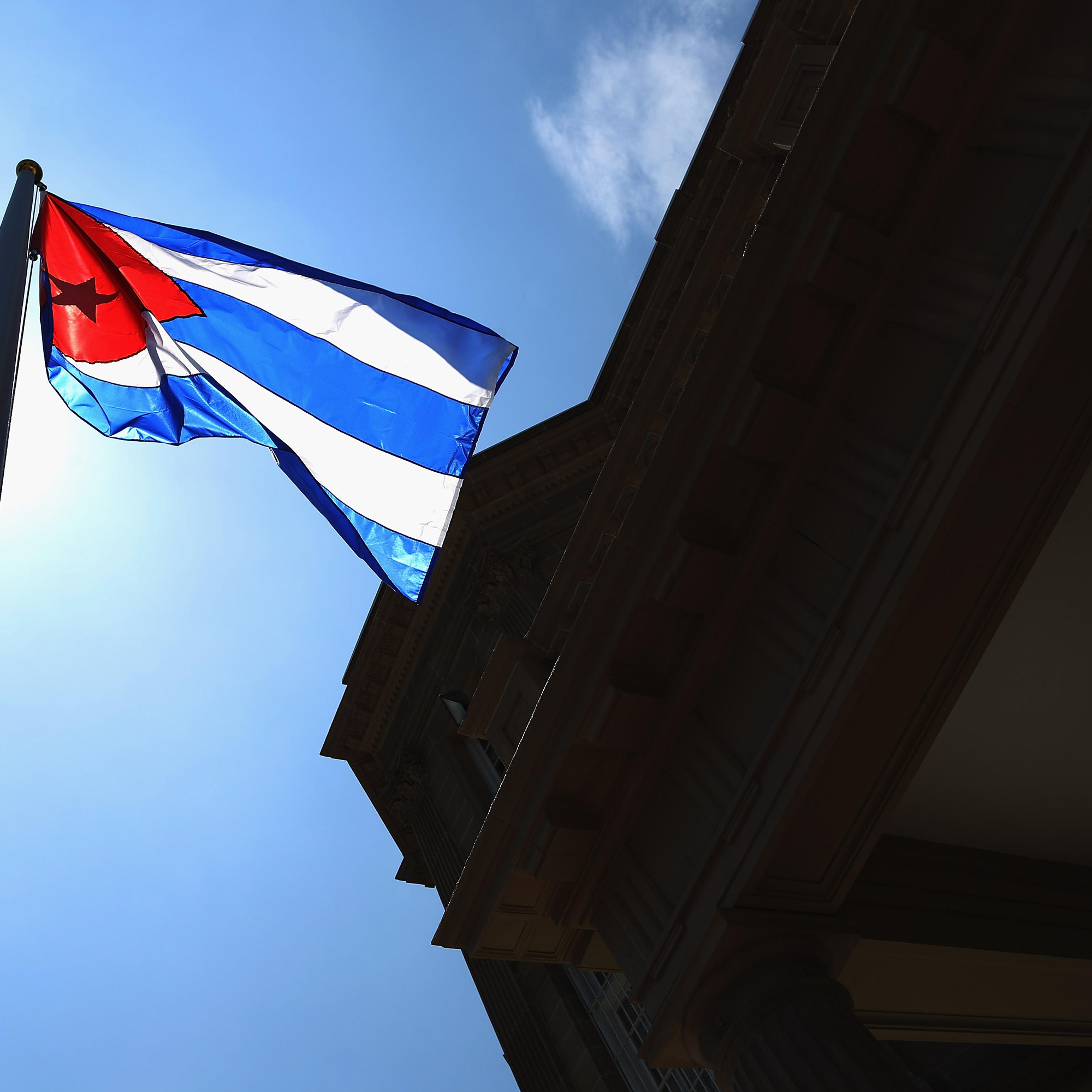 The Cuban flag flies in front of the country's embassy for the first time in 54 years in Washington, DC. on July 20, 2015.