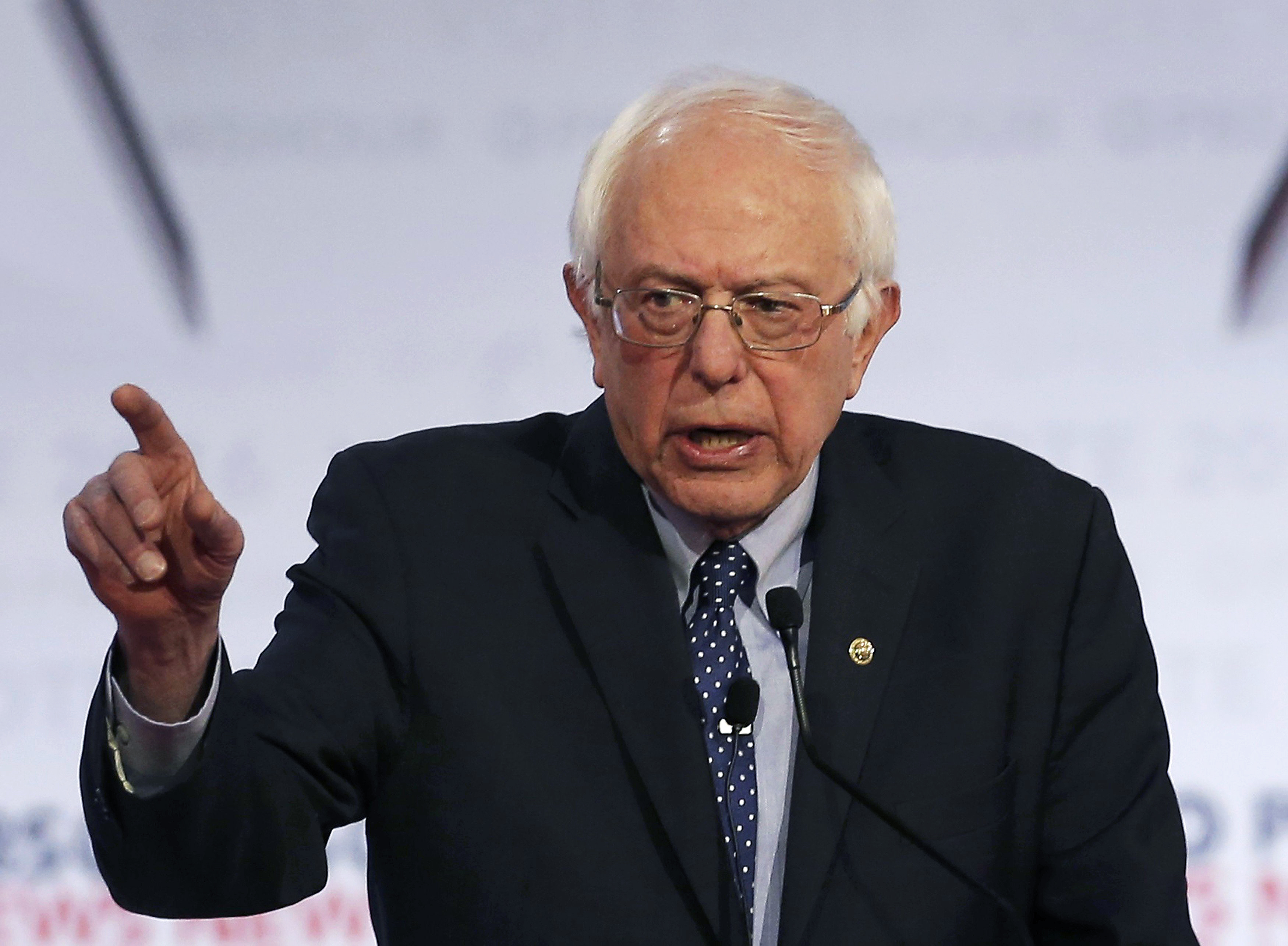 Democratic. presidential candidate, Vermont Senator Bernie Sanders appears with former Secretary of State Hillary Clinton at a debate in Milwaukee on Feb. 11, 2016.