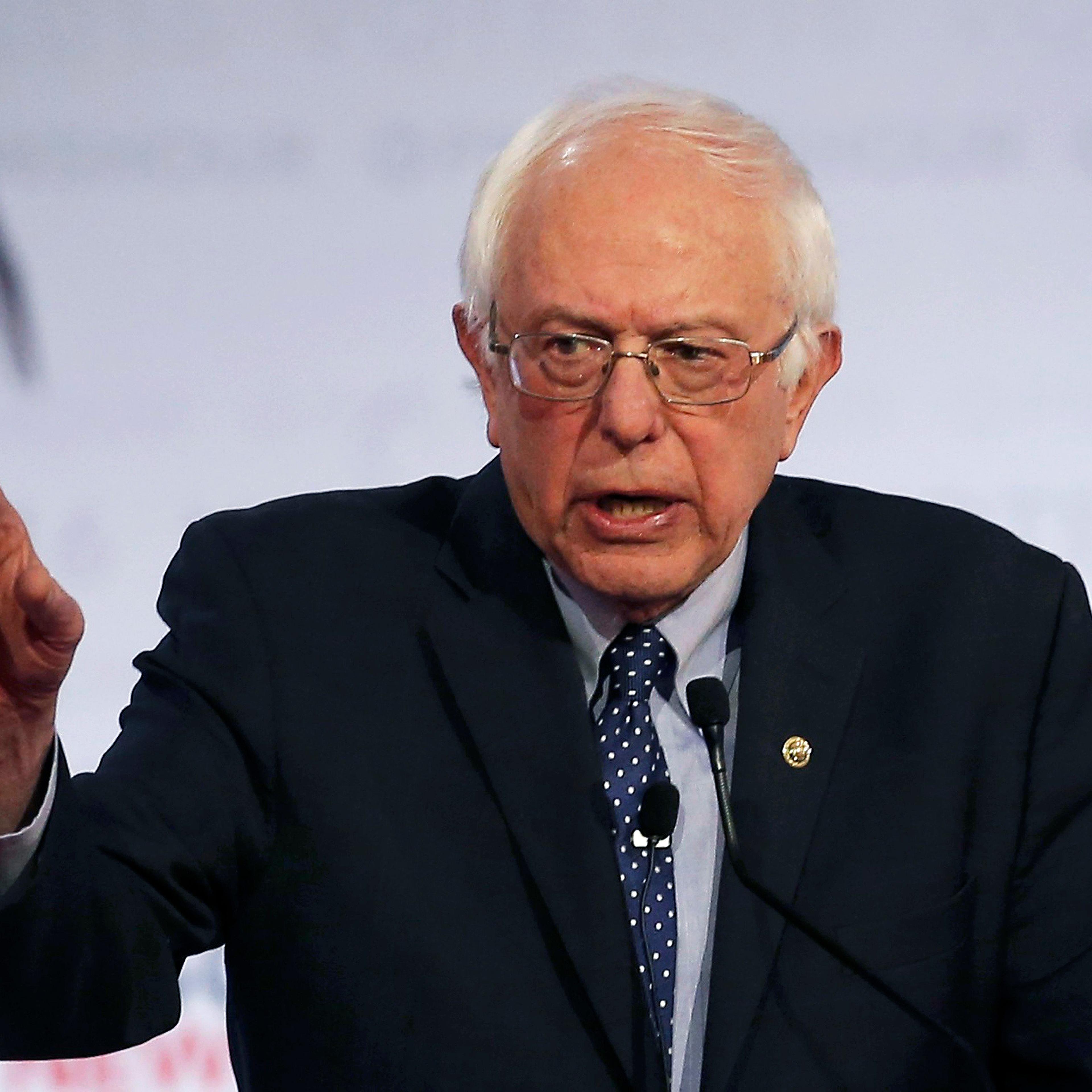 Democratic. presidential candidate, Vermont Senator Bernie Sanders appears with former Secretary of State Hillary Clinton at a debate in Milwaukee on Feb. 11, 2016.