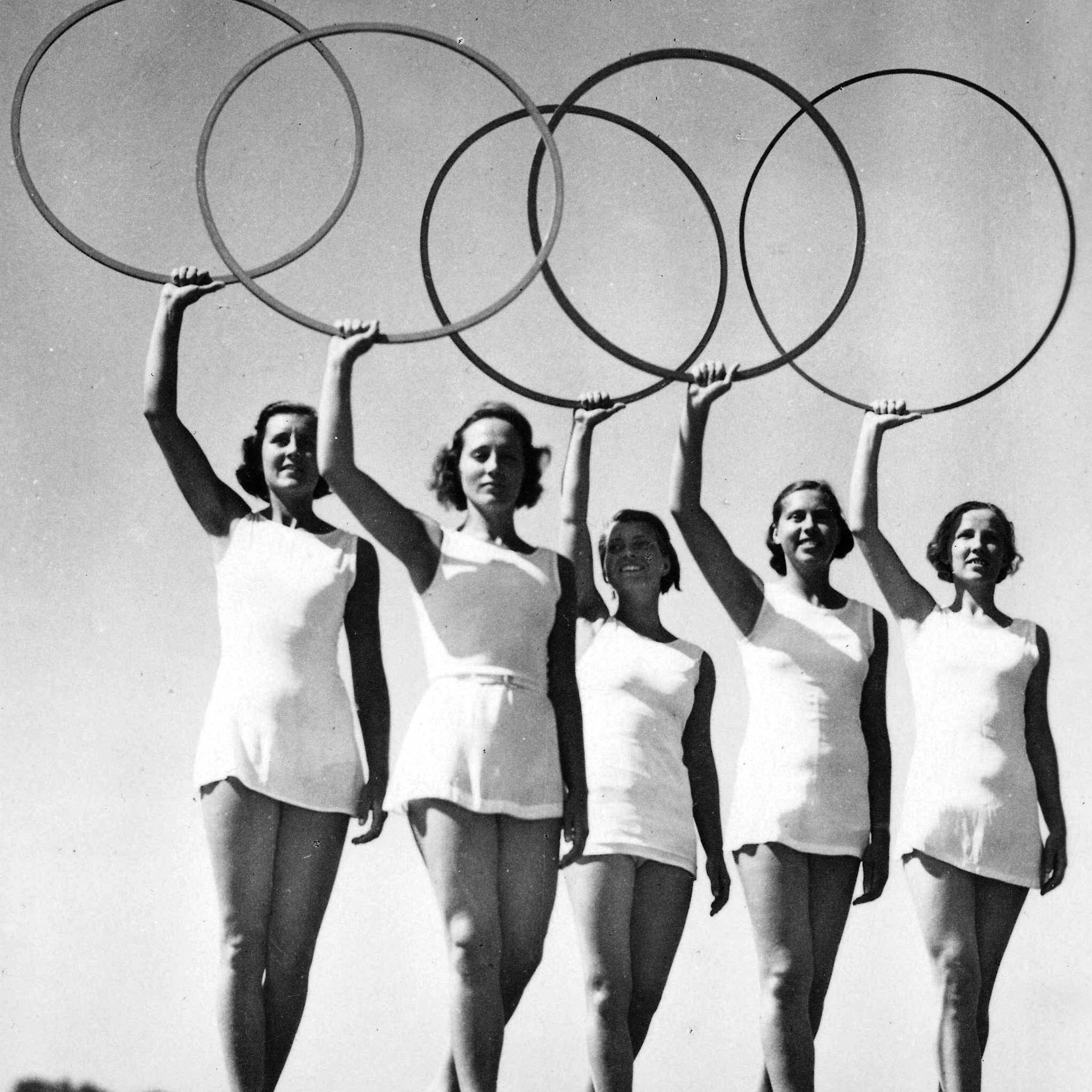 1936 Olympic Games, Berlin, Germany. Five young women take part in a display of the Olympic Rings.