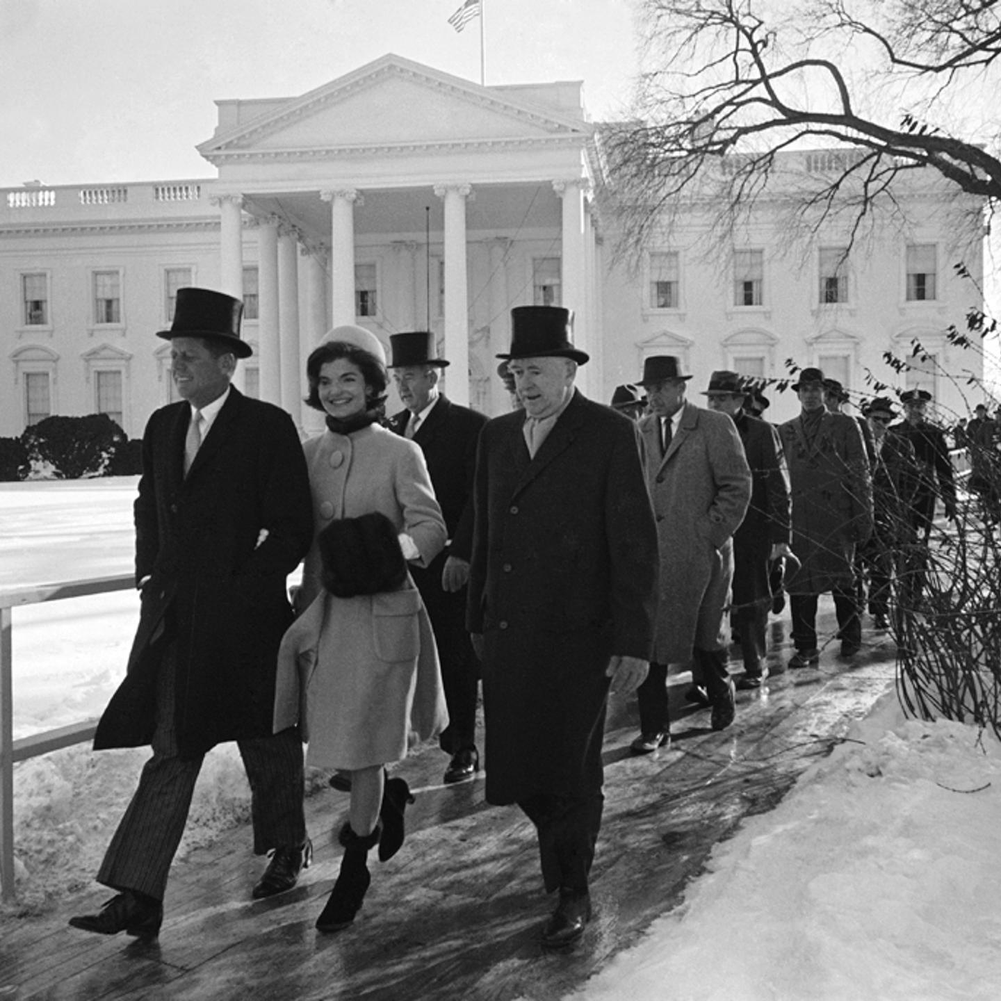 John and Jackie Kennedy walk to JFK's inauguration ceremony from the White House, January 1961.