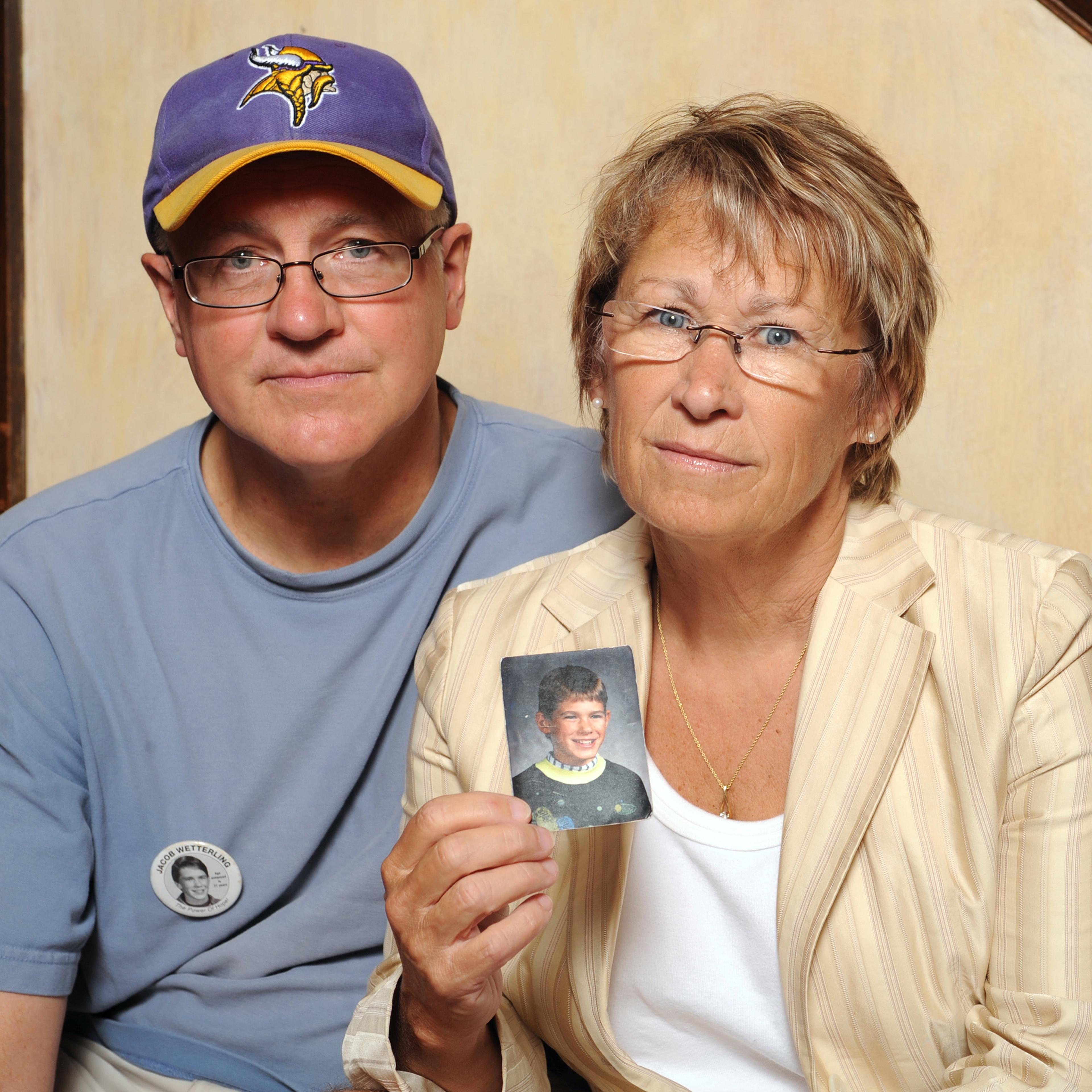 Patty and Jerry Wetterling show a photo of their son Jacob Wetterling, who was abducted in October of 1989 in St. Joseph, Minnesota, Aug. 28, 2009.