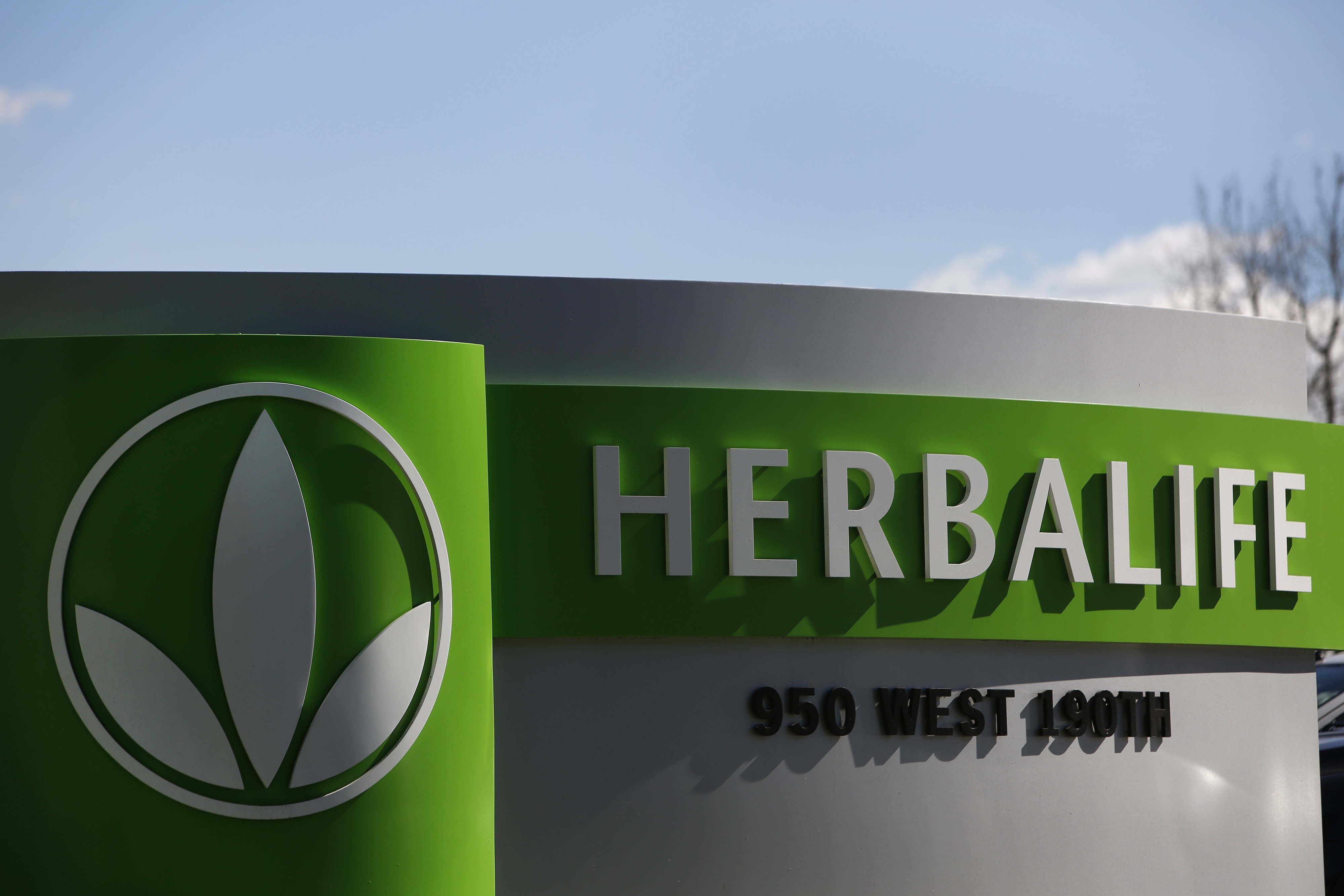 Herbalife Ltd. signage is displayed outside of Herbalife Plaza in Torrance, Calif. on Feb. 3, 2014.
