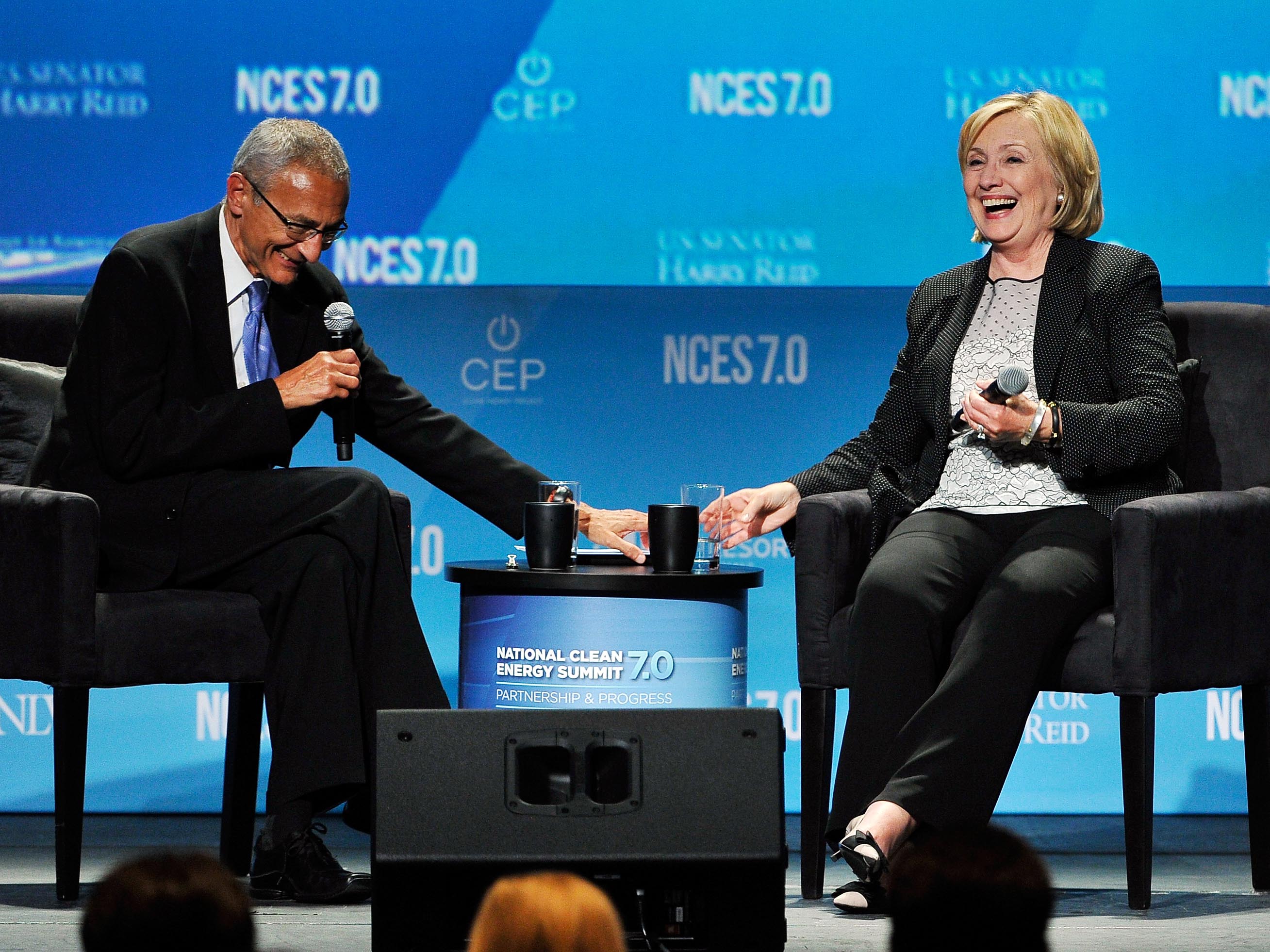 John Podesta, left, and Hillary Clinton attend the National Clean Energy Summit 7.0 on Sept. 4, 2014 in Las Vegas.