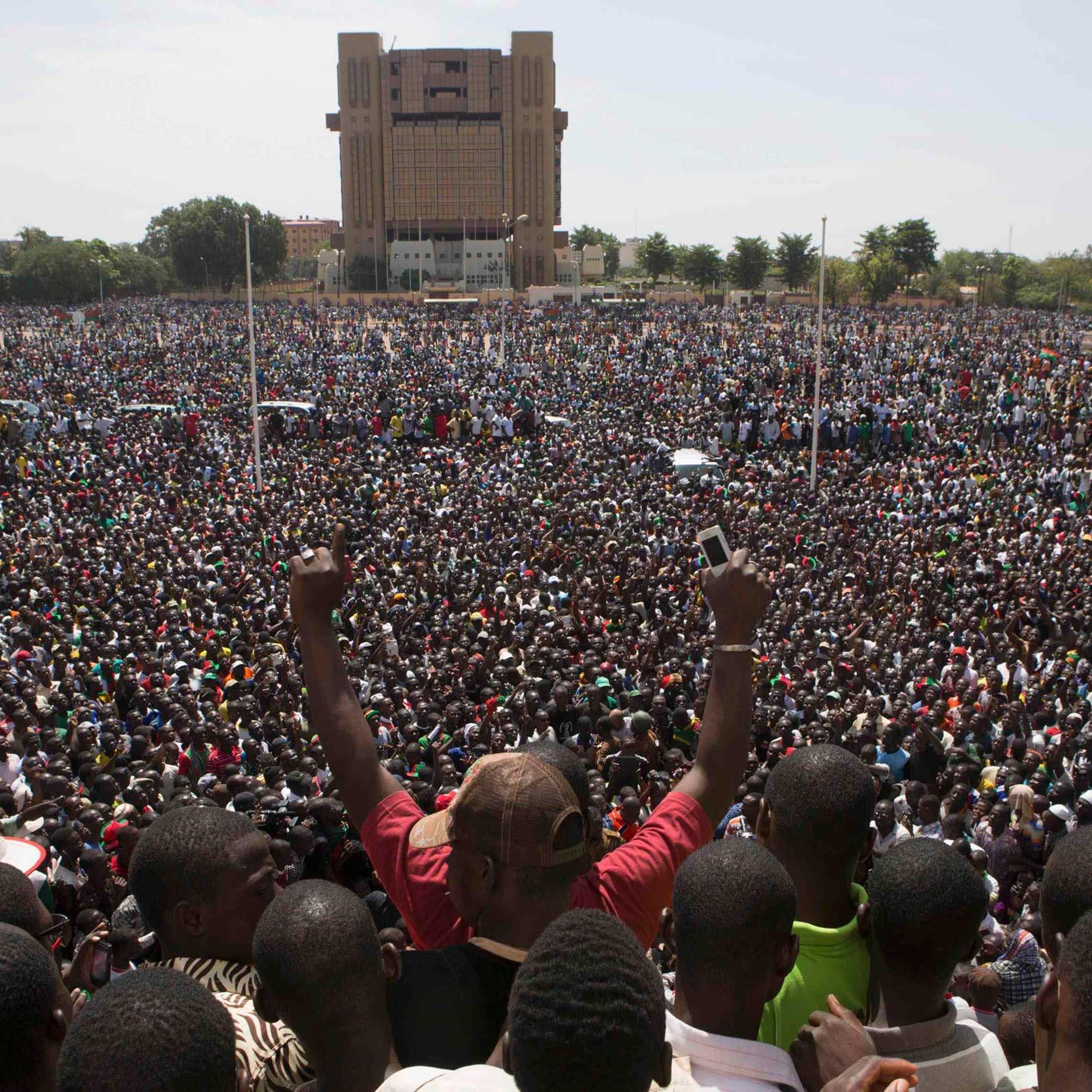 Anti-government protesters gather in the Place de la Nation in Ouagadougou, capital of Burkina Faso, Oct. 31, 2014.