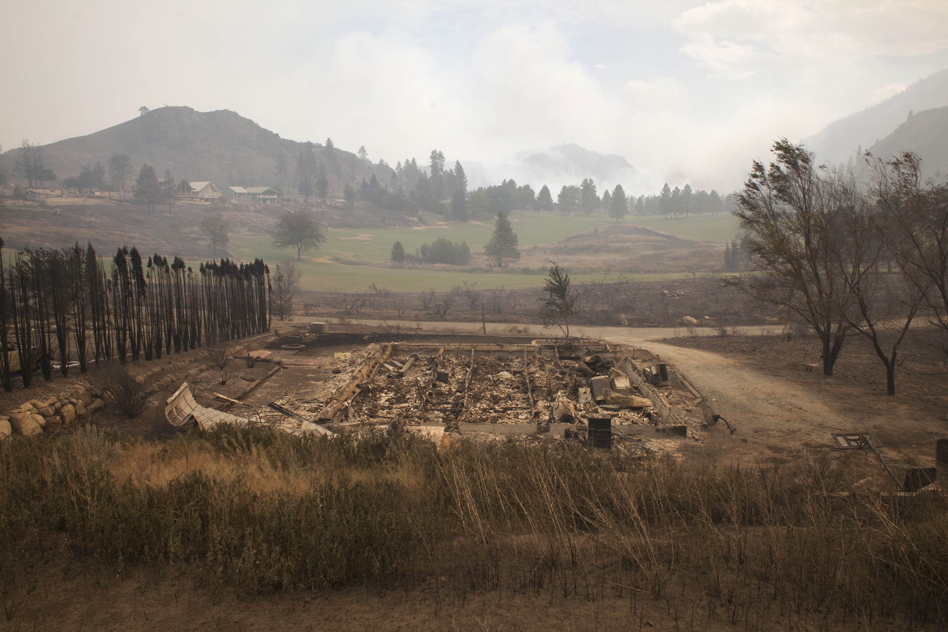 Debris from a burnt structure is pictured near Alta Lake Golf Course after much of the surrounding area was consumed by the Carlton Complex Fire near Pateros