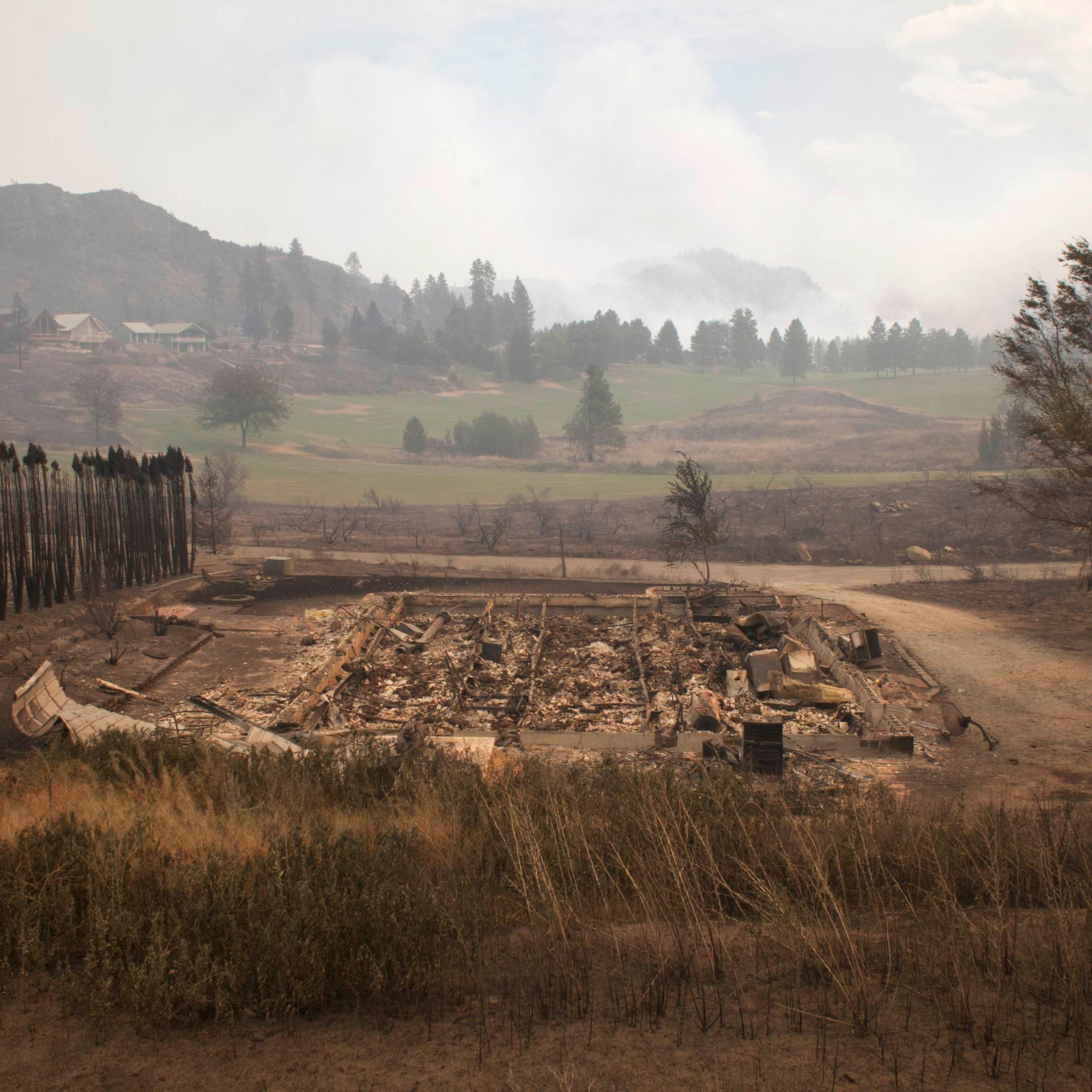 Debris from a burnt structure is pictured near Alta Lake Golf Course after much of the surrounding area was consumed by the Carlton Complex Fire near Pateros