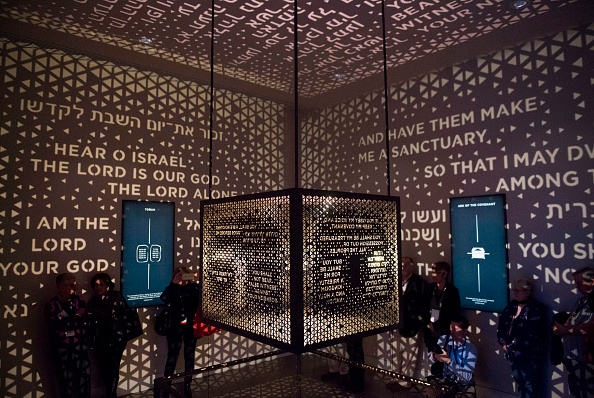Visitors walk through the Ark of the Covenant exhibit as part of the "Journey through the Hebrew Bible" exhibit during a media preview of the new Museum of the Bible, a museum dedicated to the history, narrative and impact of the Bible, in Washington, DC