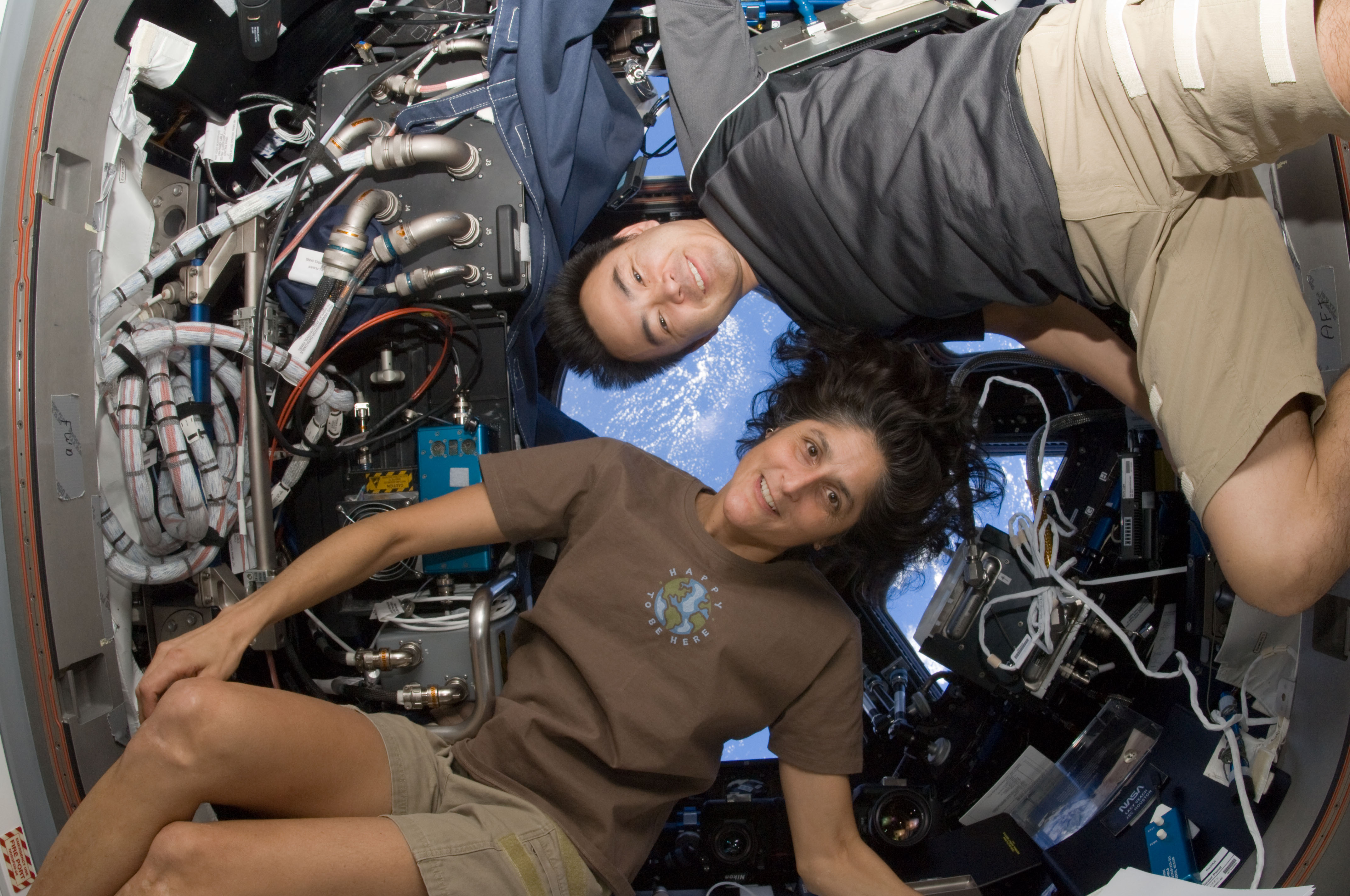 NASA astronaut Sunita Williams, Expedition 33 commander; and Japan Aerospace Exploration Agency astronaut Aki Hoshide, flight engineer, pose for a photo in the Cupola of the International Space Station.