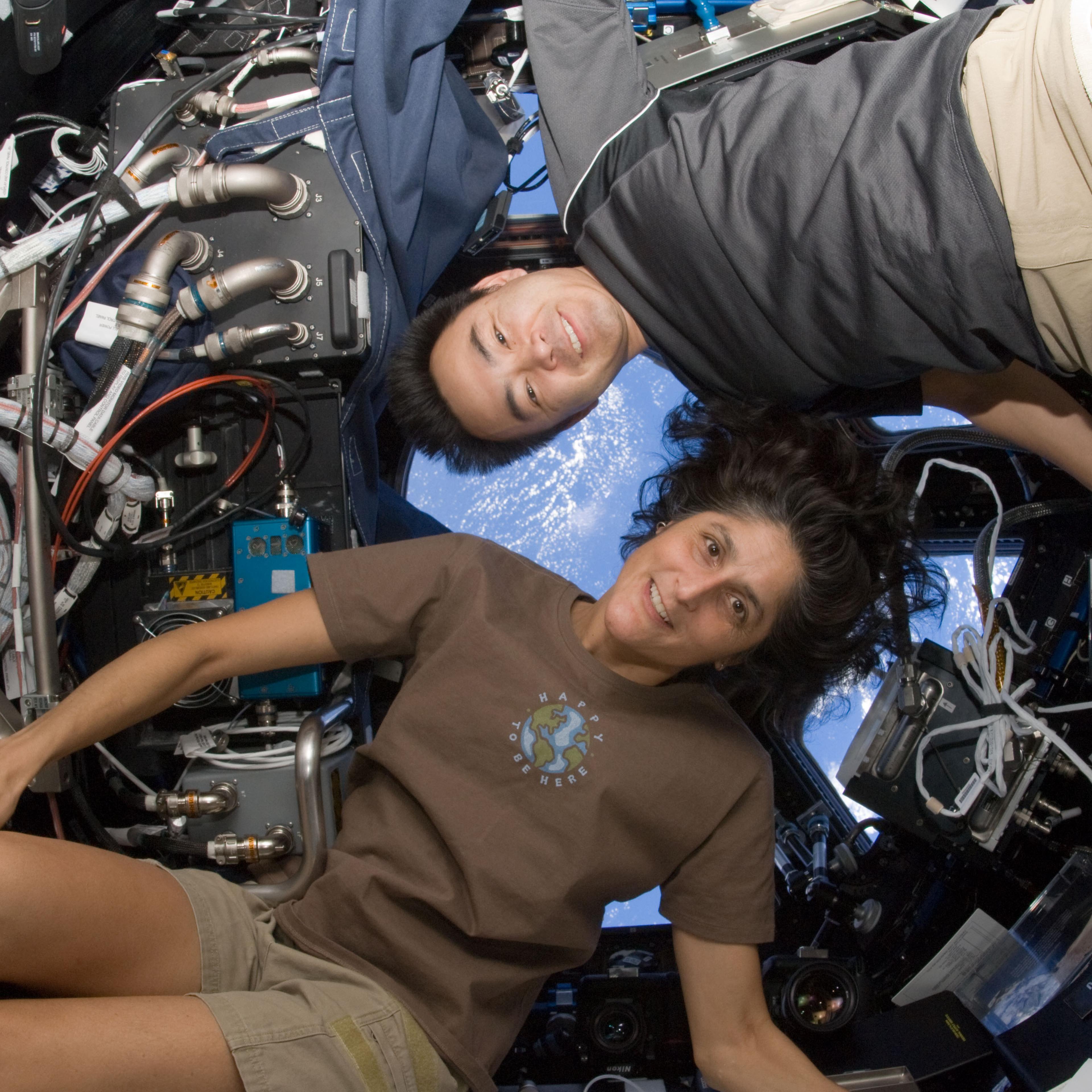 NASA astronaut Sunita Williams, Expedition 33 commander; and Japan Aerospace Exploration Agency astronaut Aki Hoshide, flight engineer, pose for a photo in the Cupola of the International Space Station.