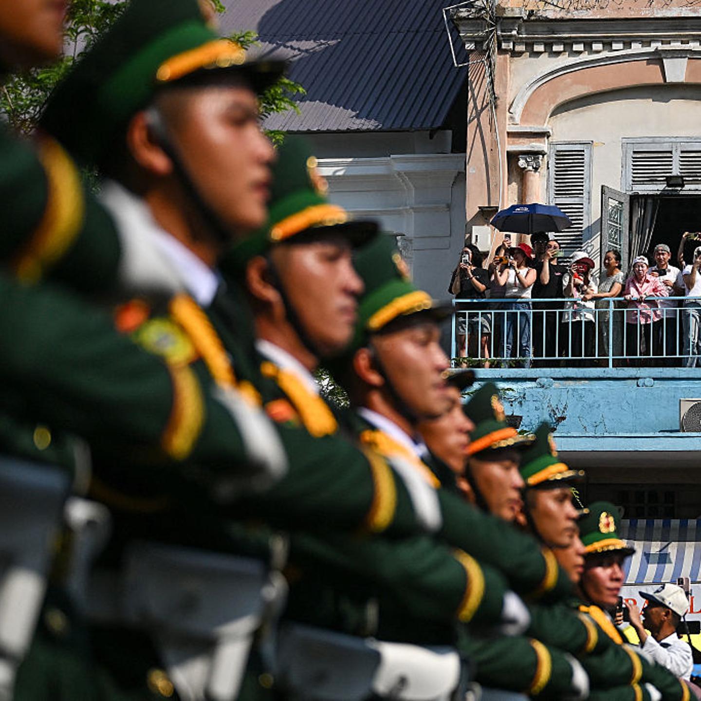 Spectators watch as soldiers take part in a parade to mark the 50th anniversary of the end of the Vietnam War in Ho Chi Minh City, Vietnam, on April 30, 2025.