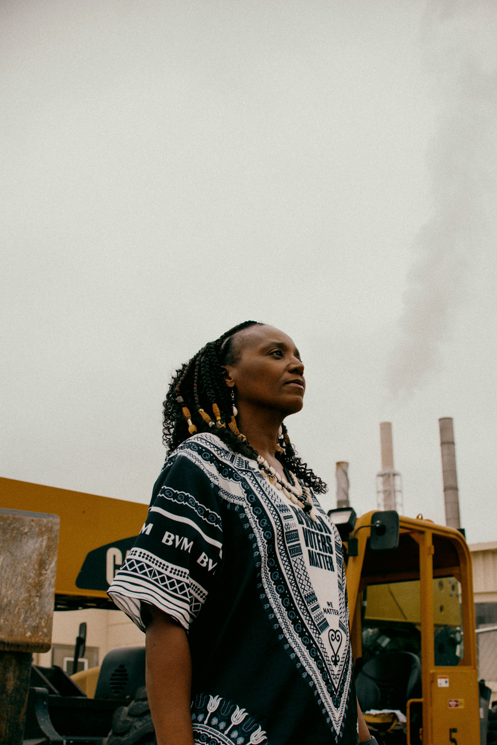Stephanie Williams, a former Kalamazoo city commissioner and a community activist, stands outside the Graphic Packaging International paper mill in Kalamazoo, Mich.., which some residents say has benefited from big tax breaks while polluting surrounding areas. 