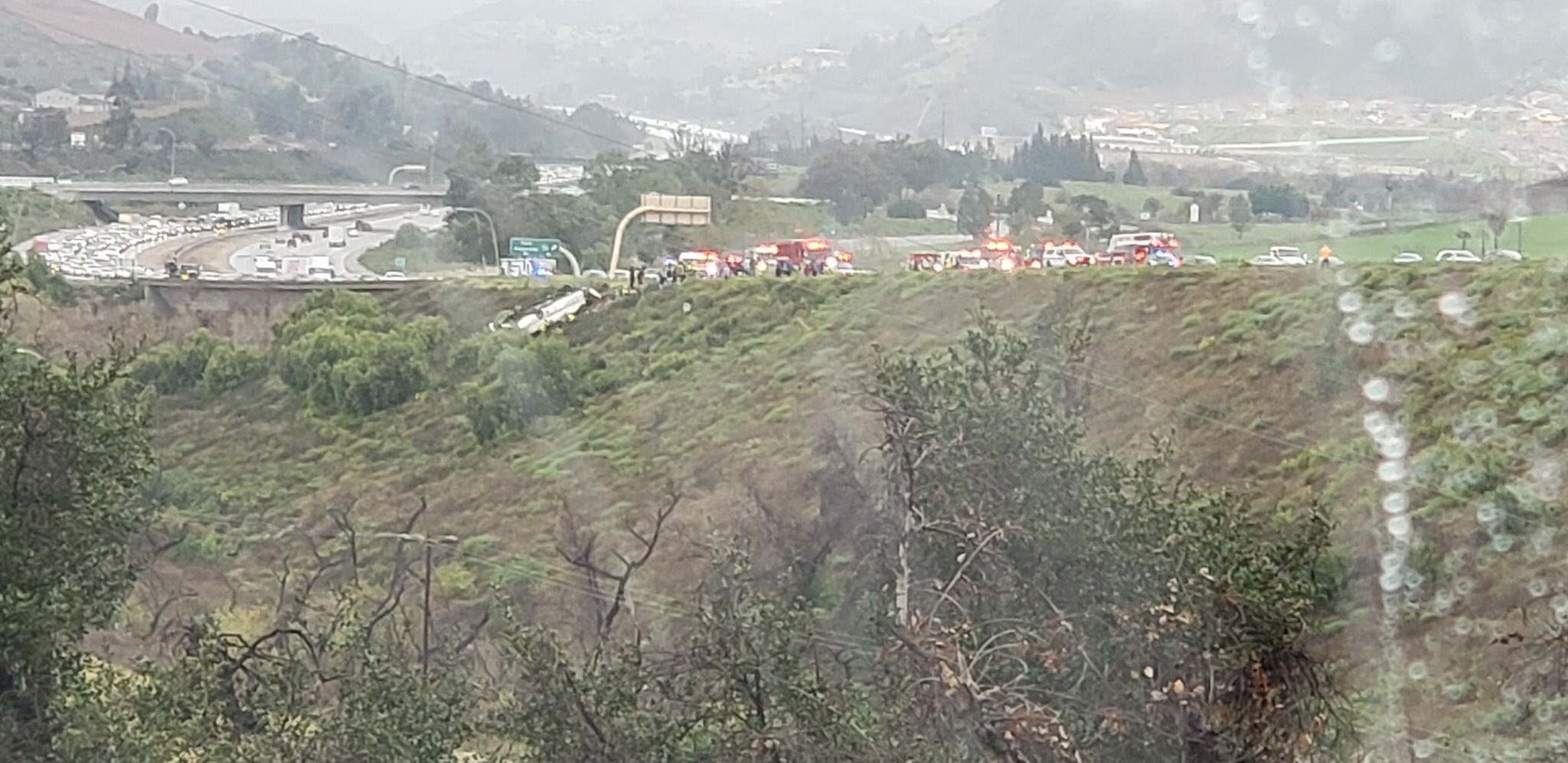 A bus rolled over on the southbound side of I-15, trapping multiple people and killing at least 3, according to officials, in Fallbrook, Calif., on Feb. 22, 2020.